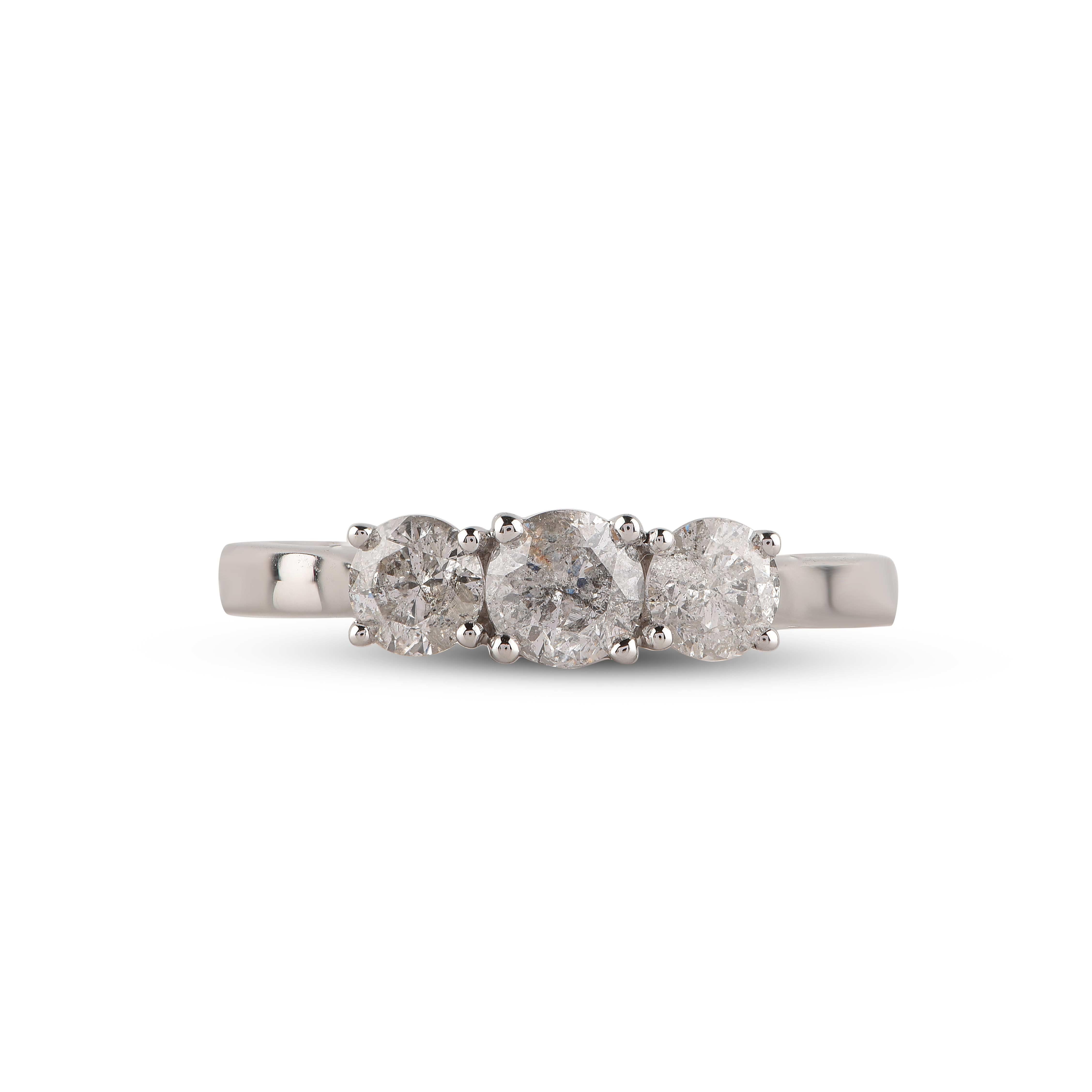This elegant diamond ring shines bright with 3 brilliant-cut diamonds set in prong setting and handcrafted in 14-karat white gold. The diamonds are graded H-I Color, I2 Clarity.  

Metal color and ring size can be customized on request. 

This piece