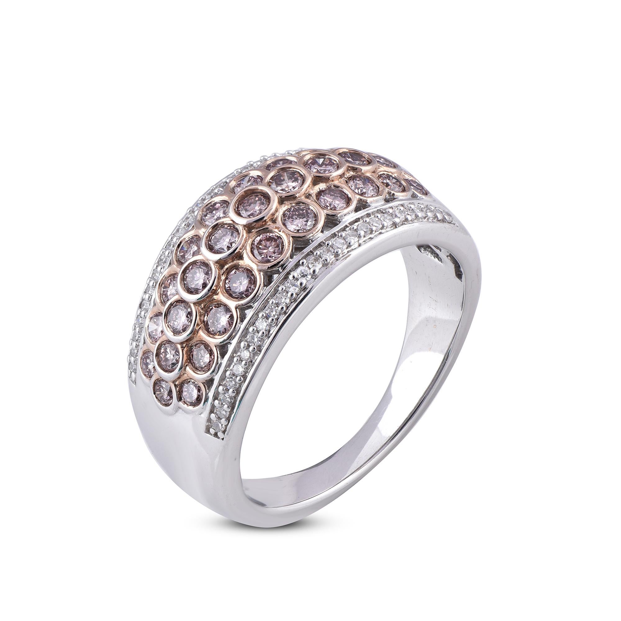 Classic and Contemporary, this diamond ring will enhance her jewelry collection. Embellished with 50 natural round and 31 pink diamonds 1.00 Carat diamond studded beautifully in bezel setting. Hand crafted beautifully in solid 18 Kt white gold and
