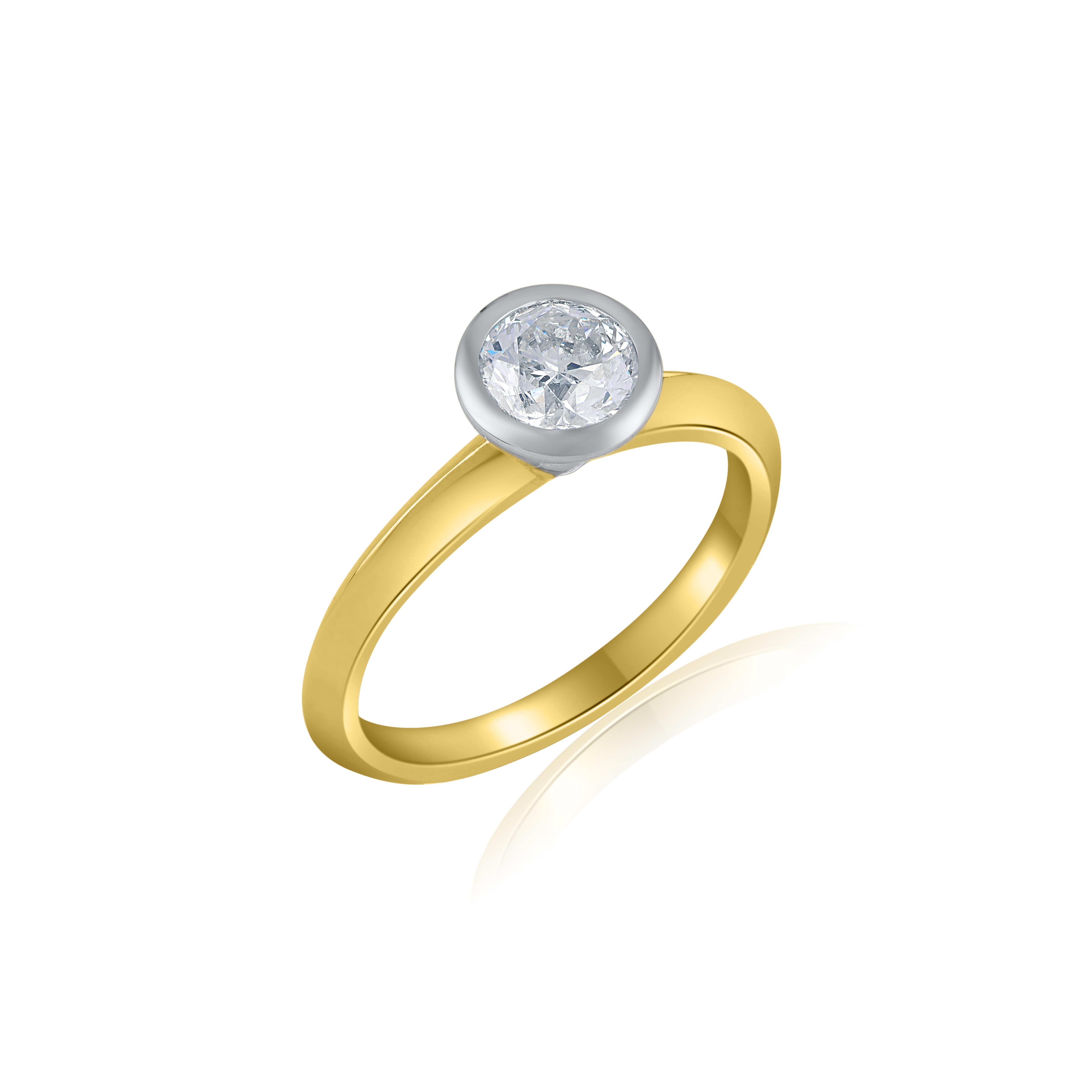 Elegantly designed, this ring is a 1 carat Solitaire Engagement ring in bezel setting. Diamonds are graded HI Color, I2 Clarity. This ring is made in Two tone gold with shank in yellow gold and bezel part in white gold. Currently available in US