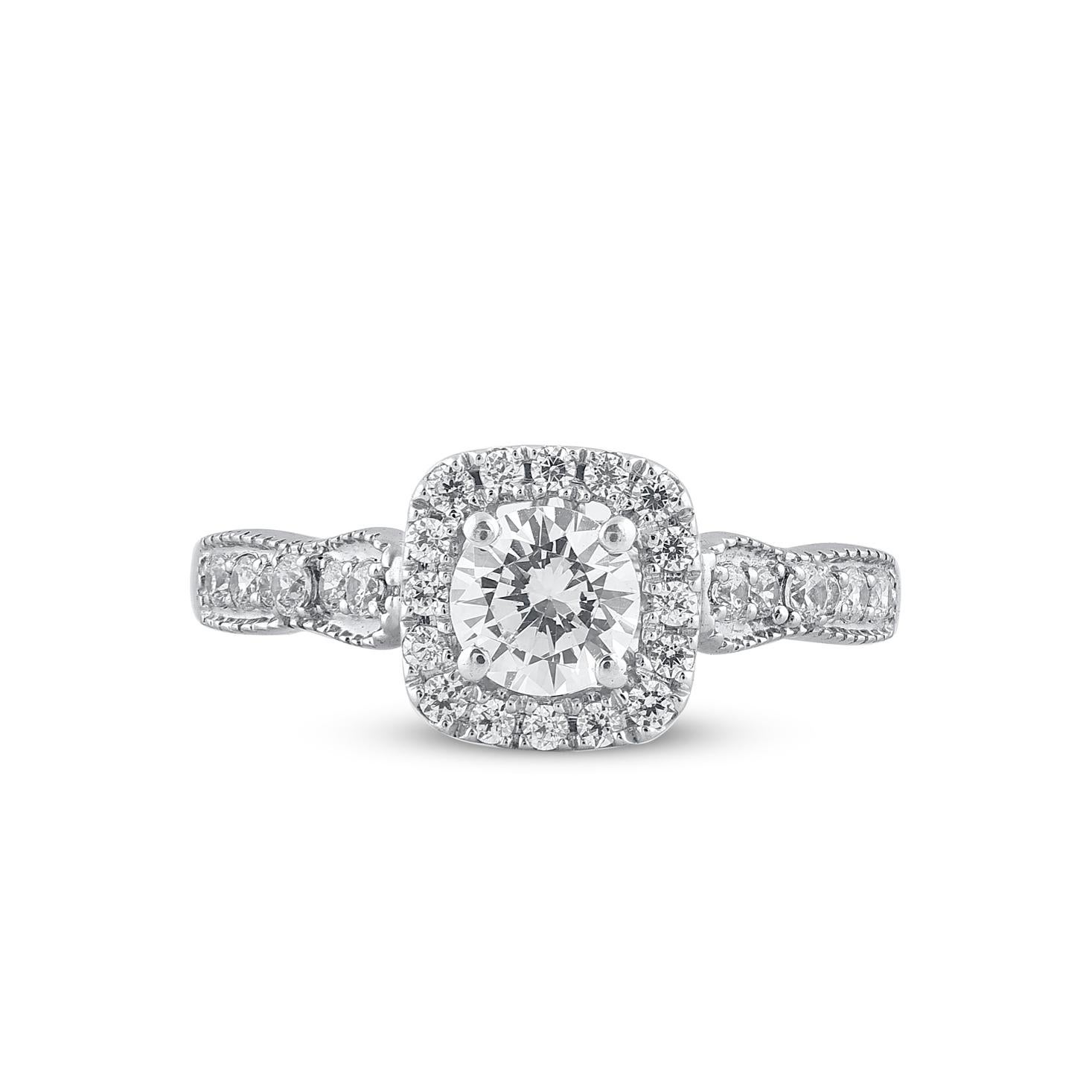 Express your love for her in the most classic way with this halo ring. Beautifully crafted by our inhouse experts in 14 karat white gold and embellished with 29 brilliant cut round diamond set in prong and pave setting. Total diamond weight is 1.0