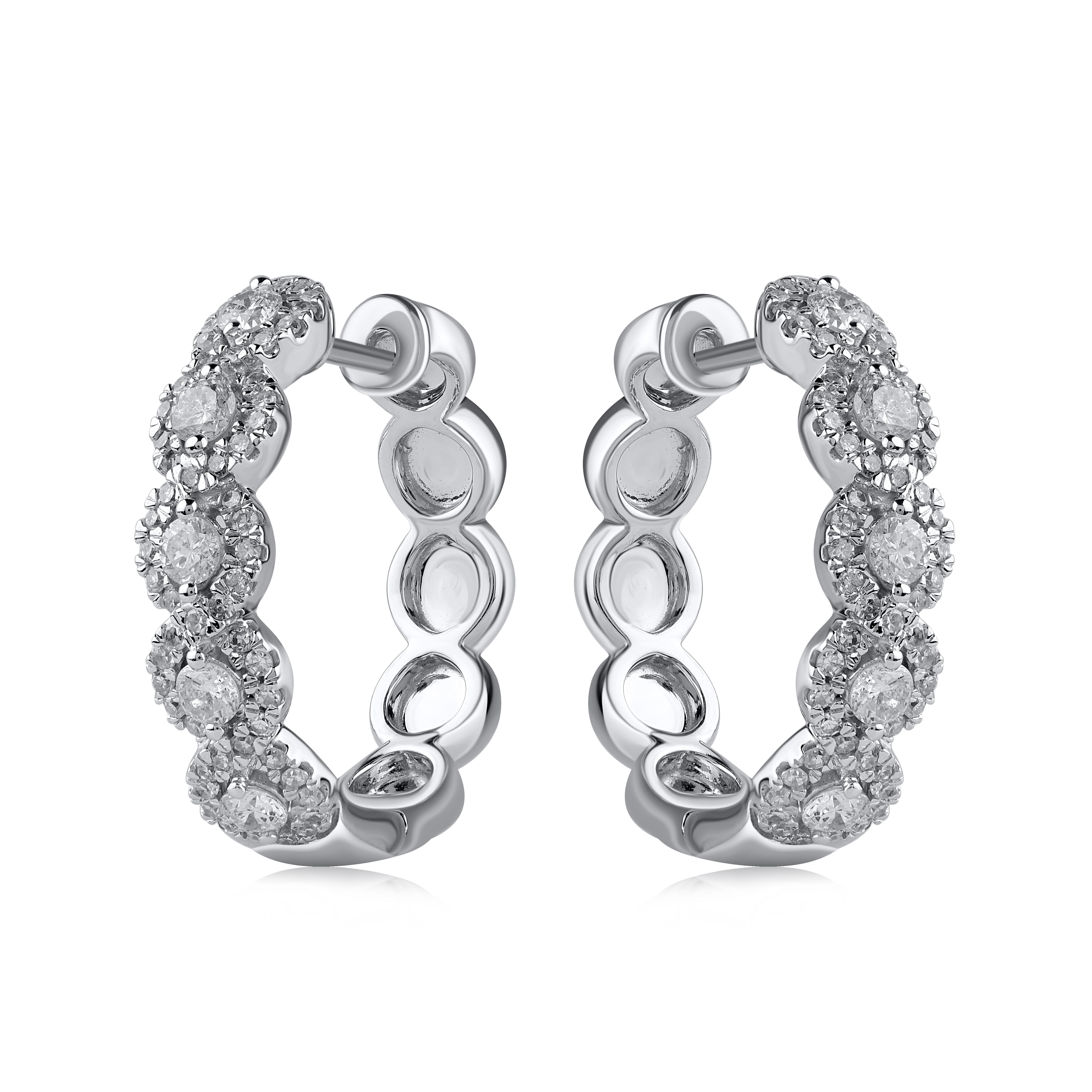 Timeless and elegant, these diamond hoop earring are a style you'll wear with every look in your wardrobe. Crafted in 18Kt white gold with 122 round diamond in prong setting. These earring secure with hinged backs. The white diamonds are graded as