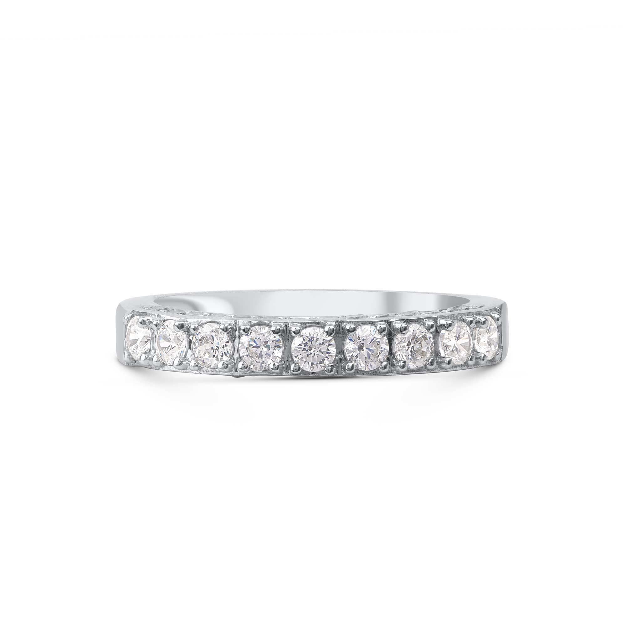 Honor your special day with this exceptional diamond band ring. This band ring features a sparkling 38 brilliant cut round diamonds beautifully set in prong & pave setting. The total diamond weight is 1.0 Carat. The diamonds are graded as H-I color