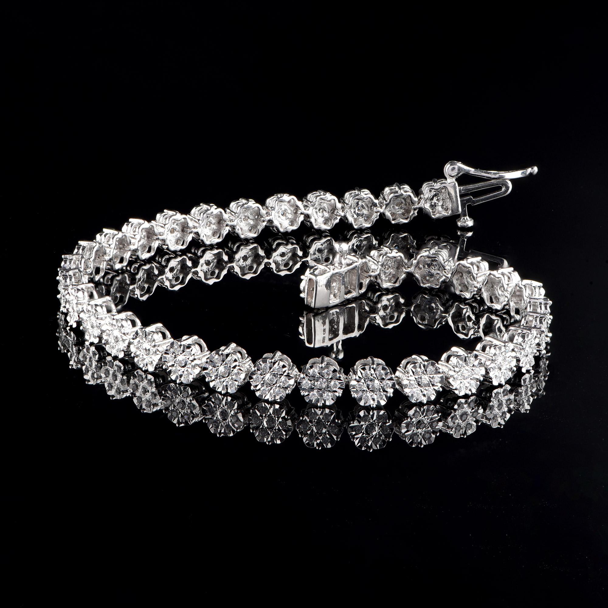 Beautifully designed in 18-karat white gold and dazzles with 245 brilliant cut diamonds embedded beautifully in miracle plate setting. Diamonds are graded H-I Color, I2 Clarity. 

This piece is made to order, please allow 2-3 weeks for manufacturing.