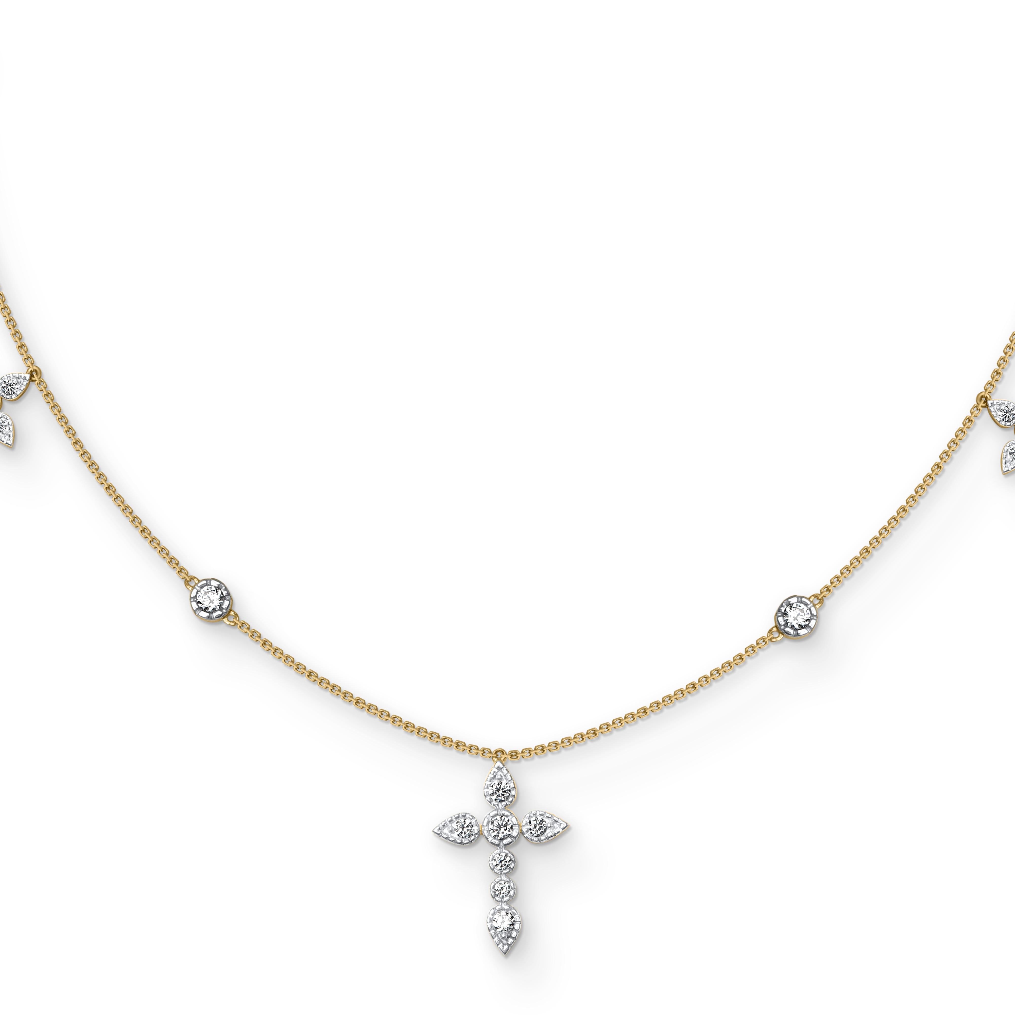 Questa collana con ciondolo a croce presenta 25 diamanti brillanti incastonati a castone e realizzati a mano in oro giallo 18 kt. I diamanti sono classificati con colore H. H. I. e purezza I2. 

Questo pezzo è realizzato su ordinazione. Si prega di