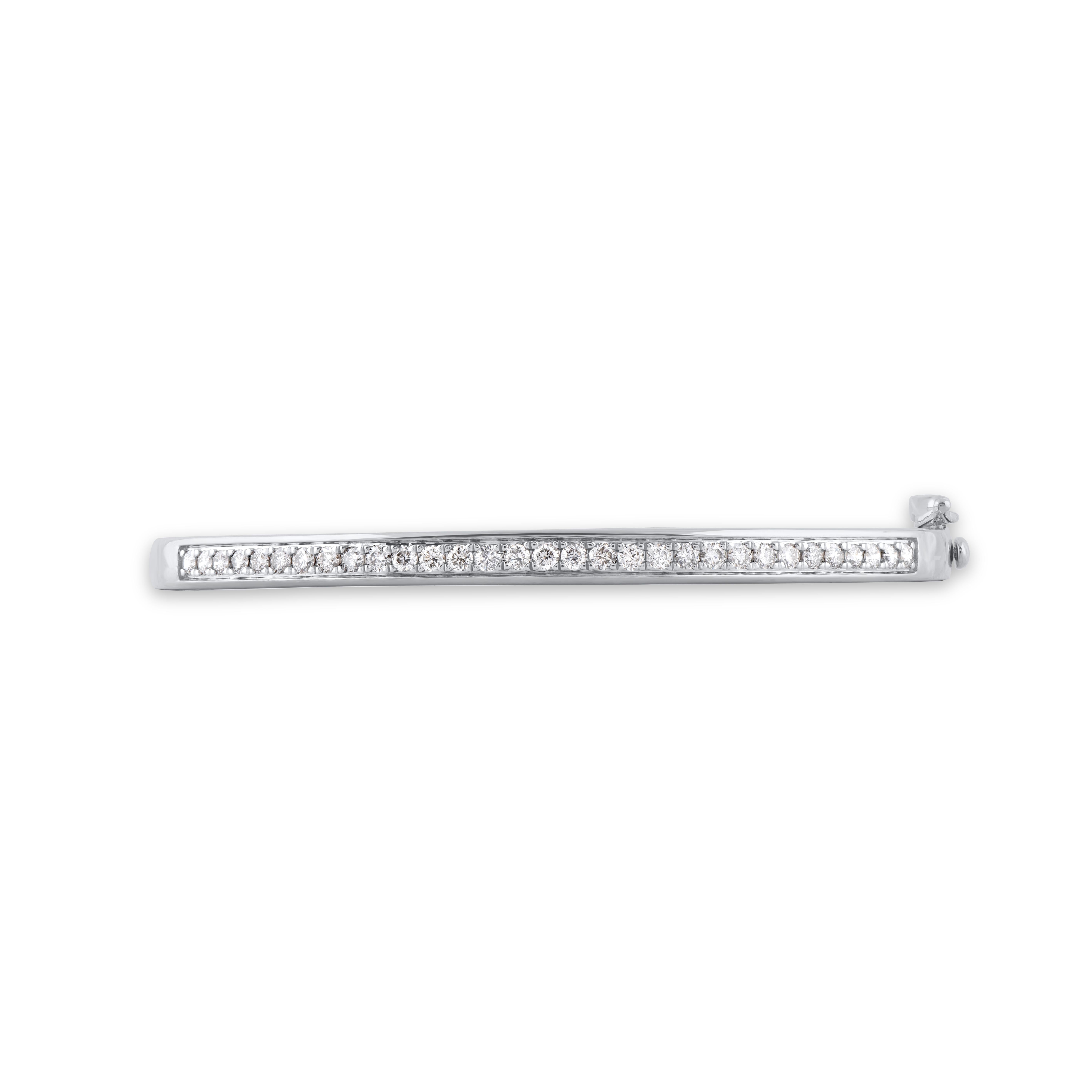 Express your sophisticated style with this gorgeous diamond bangle bracelet. This ring is beautifully crafted in 14 Karat white gold and embedded with 31 natural brilliant cut diamonds in pave setting. The total diamond weight is 1.0 carat. Diamonds