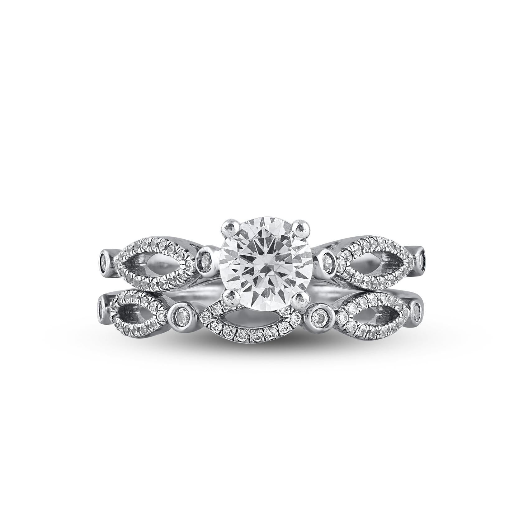 On that special day, express all your love with this elegant and dazzling diamond bridal set. Crafted in 14 Karat white gold. This wedding ring features a sparkling 87 brilliant cut and single cut round diamond beautifully set in prong, pave and