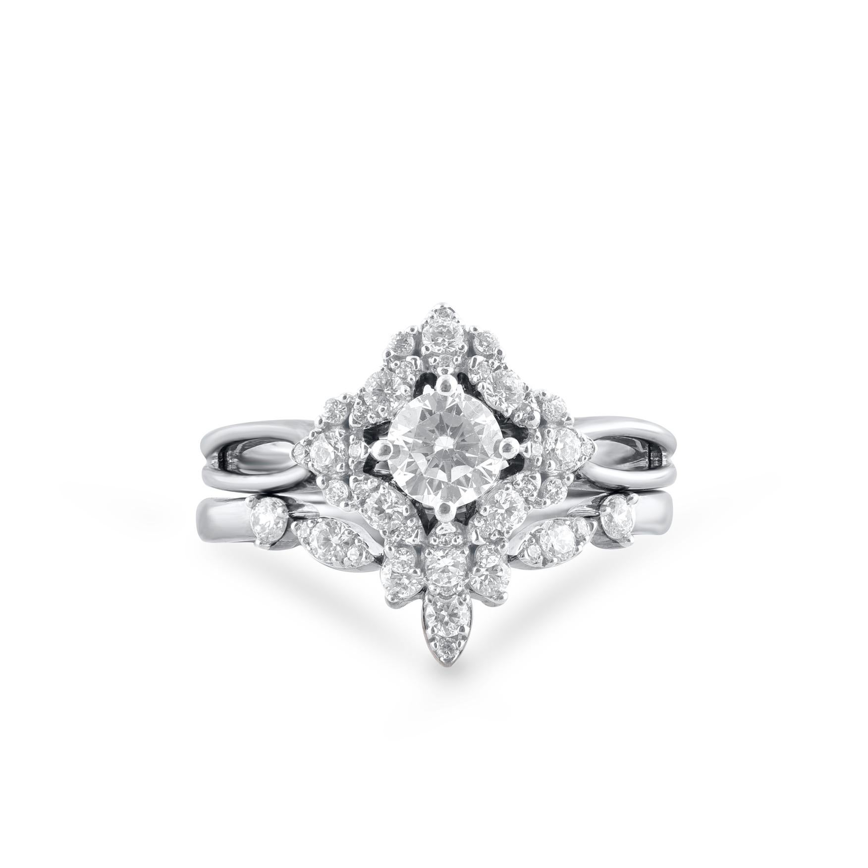 Give her a beautiful symbol of your love with this vintage style diamond bridal ring set. Crafted in 14 Karat white gold. This wedding ring features a sparkling 46 brilliant cut and single cut round diamond beautifully set in prong setting. The