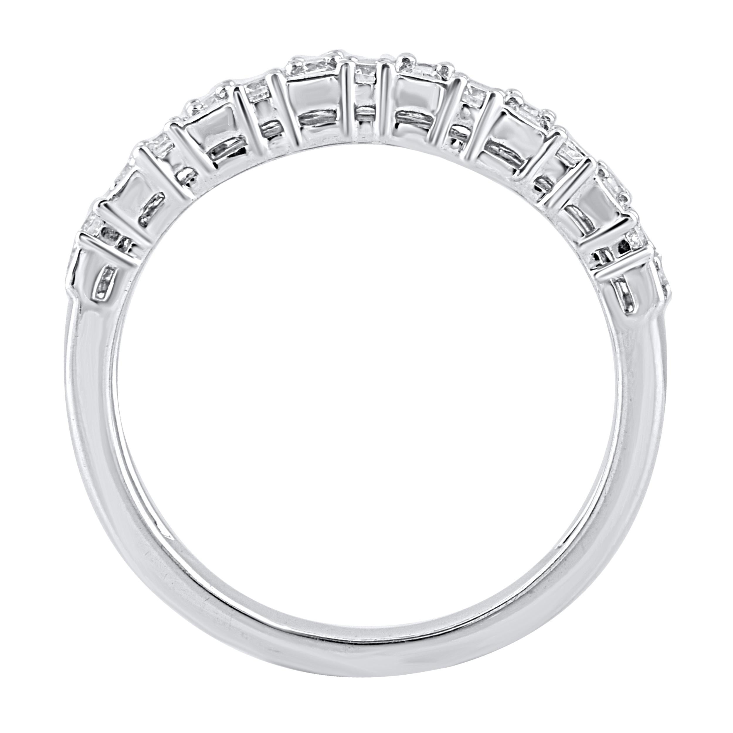 This beautiful engagement band ring features shimmering baguette diamonds and brilliant cut round diamonds in prong and channel setting. Crafted in 14 karat white gold. The ring is studded with a total of 30 baguette cut and brilliant cut natural