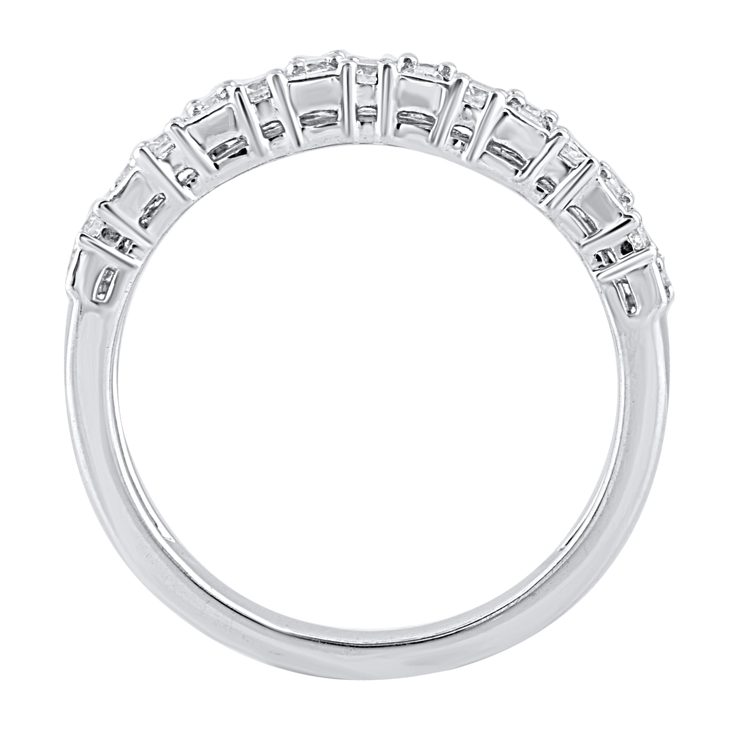 This beautiful engagement band ring features shimmering baguette diamonds and brilliant cut round diamonds in prong and channel setting. Crafted in 14 karat white gold. The ring is studded with a total of 30 baguette cut and brilliant cut natural
