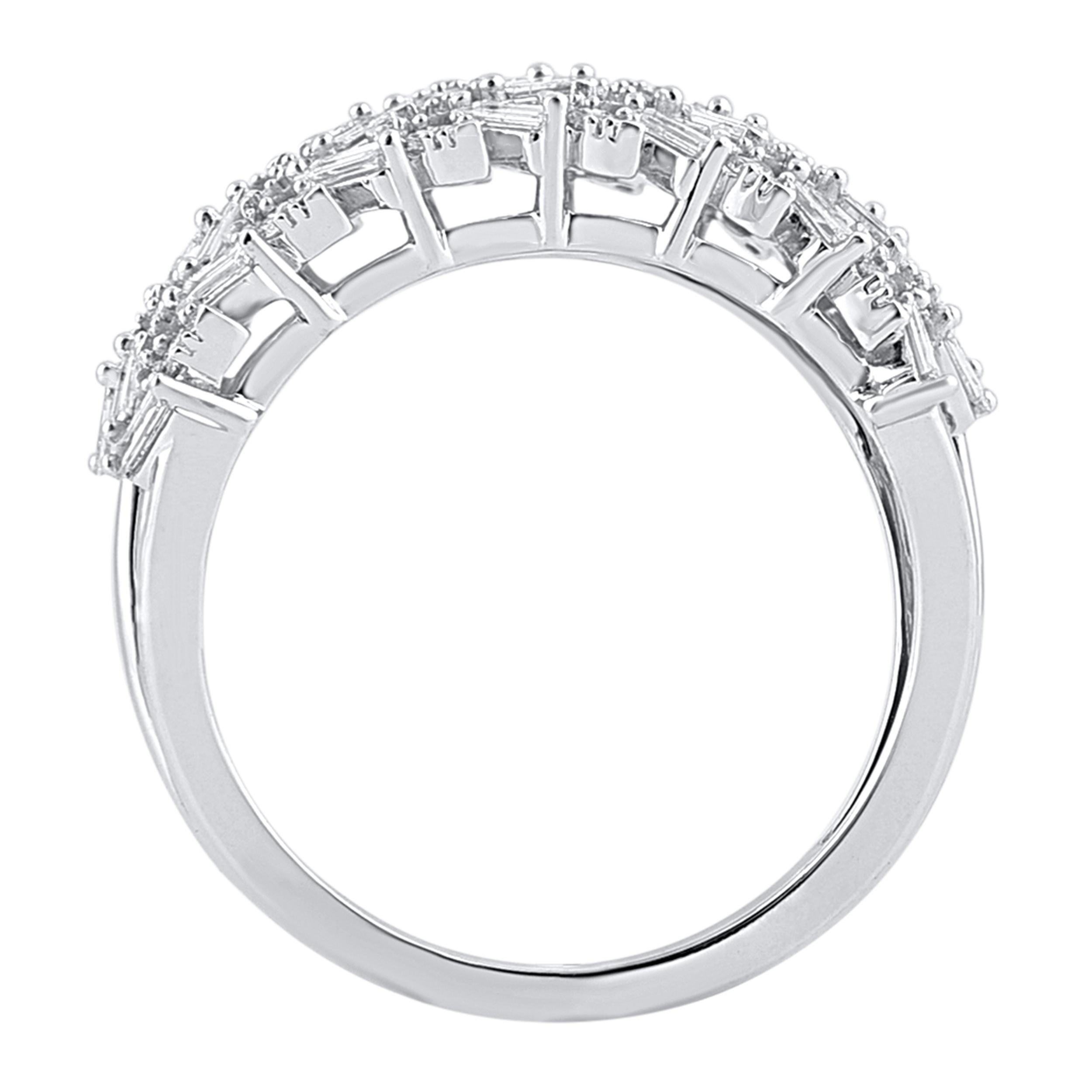 Truly exquisite, this diamond wedding band is sure to be admired for the inherent classic beauty and elegance within its design. This ring is beautifully crafted in 14 Karat white gold and embedded with 100 round brilliant, single cut & Baguette
