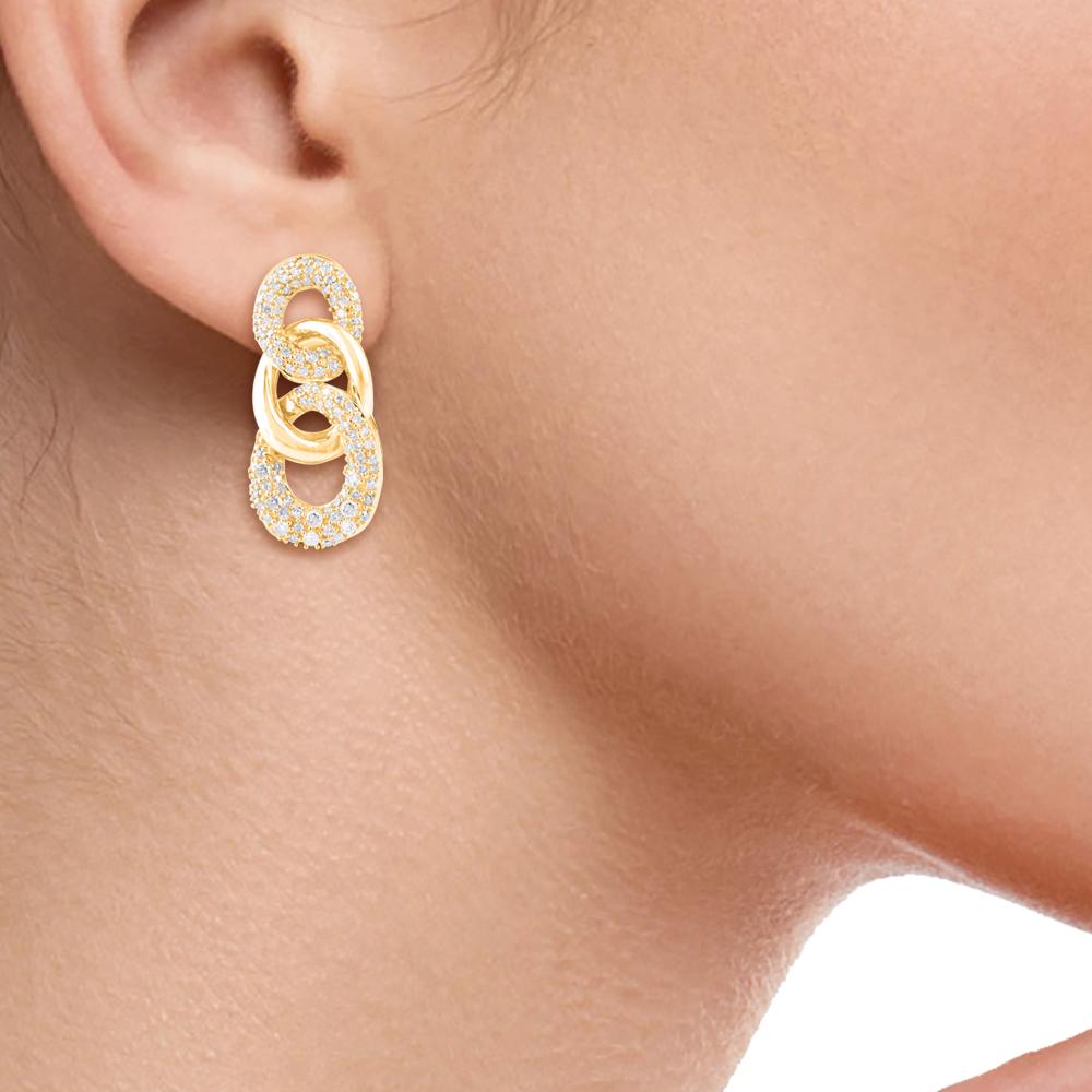 Complete your look with these sophisticated diamond dangle earrings. Crafted in 14 karat yellow gold with 236 round diamond in pave setting. These earring secure with post backs. The white diamonds are graded as H-I color and I2 clarity.