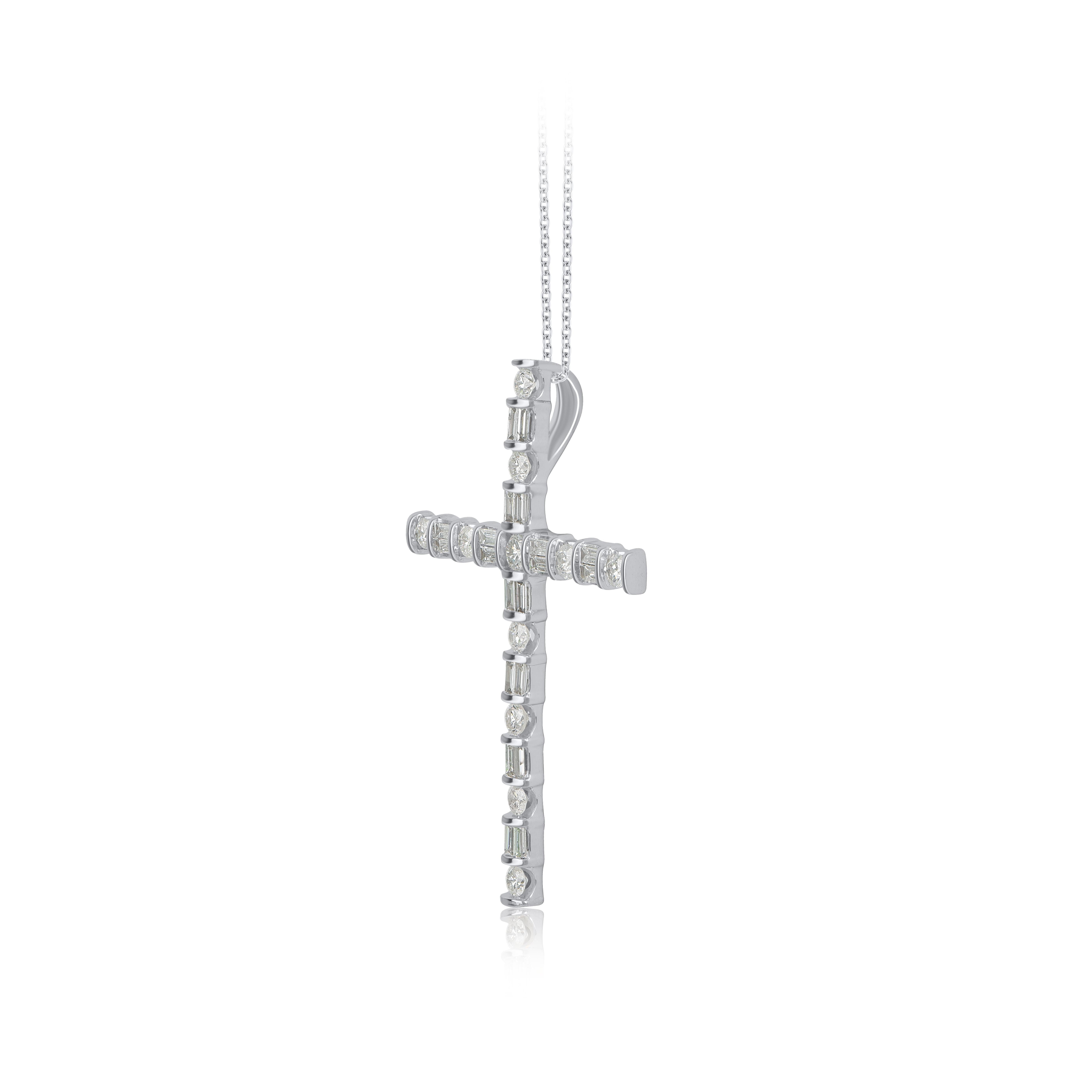 Make a bold statement of style and beliefs with the eye-catching elegance of this diamond cross pendant. Beautifully crafted by our inhouse experts in 14 karat white gold and embellished with 31 round brilliant cut & baguette cut diamond set in nic