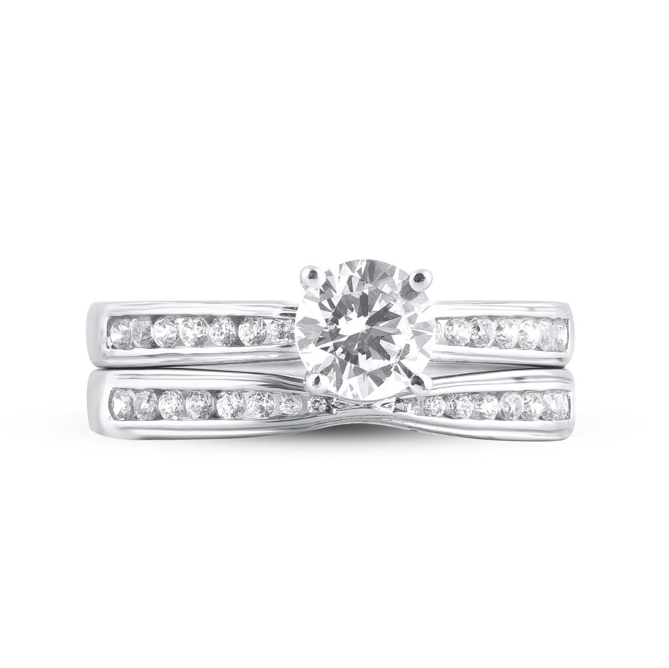 Express your love with this classic and traditional diamond bridal set. Crafted in 14 Karat white gold. This wedding ring features a sparkling 31 brilliant cut and single cut round diamonds beautifully set in prong and channel setting. The total