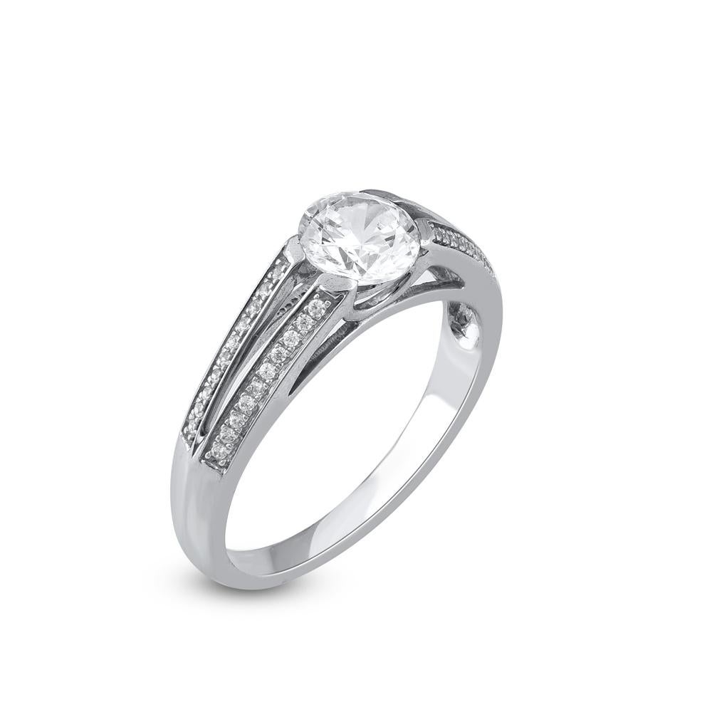 Express your love for her in the most classic way with this diamond ring. Beautifully crafted by our inhouse experts in 14 karat white gold and embellished with 41 brilliant cut and single cut round diamond set in prong and channel setting. Total
