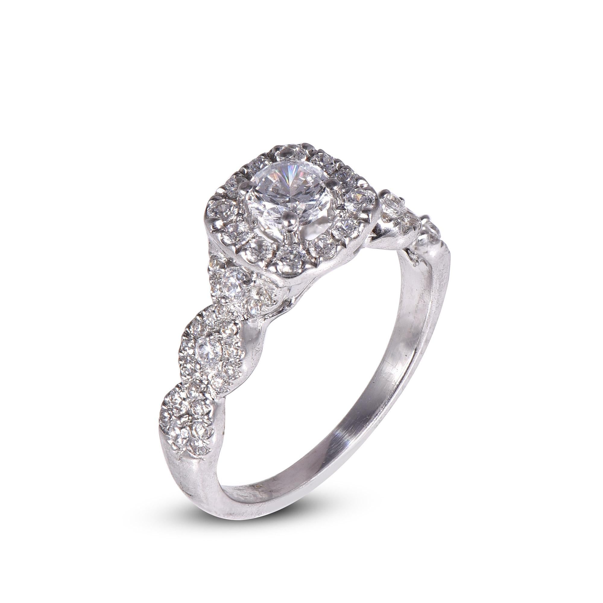 Classic and Contemporary, this diamond ring will enhance her jewelry collection. Embellished with 0.39 ct of center stone and 0.61 ct of diamond frame and twisted shank embellished beautifully in prong and pave setting. Hand crafted beautifully in