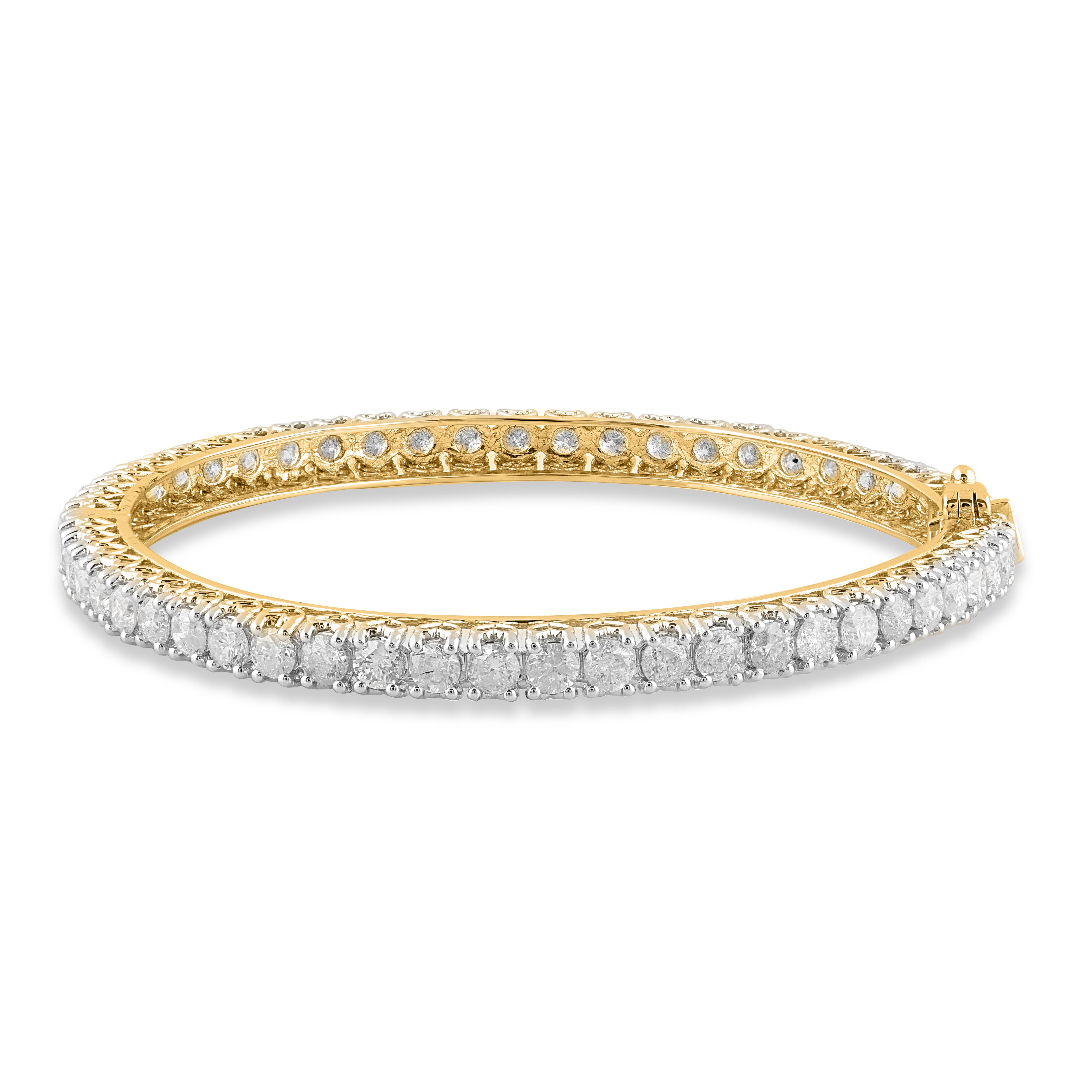 Truly exquisite, she'll admire the effortless look of this graceful diamond bangle. This designer diamond bangle features 54 round brilliant-cut diamond set in prong setting and crafted by our inhouse experts in 18 karat yellow gold. The total