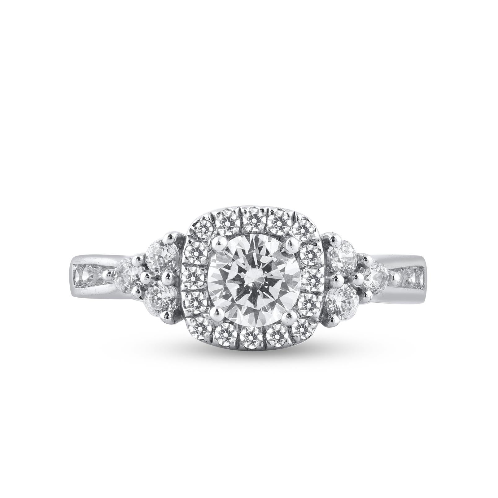 With one look of this Beautiful Round Diamond Engagement Ring crafted in 18 karat white gold. This ring is beautifully designed and studded with 0.50ct center stone and 0.50ct of diamond frame and lined diamonds on shank in prong and micro-prong