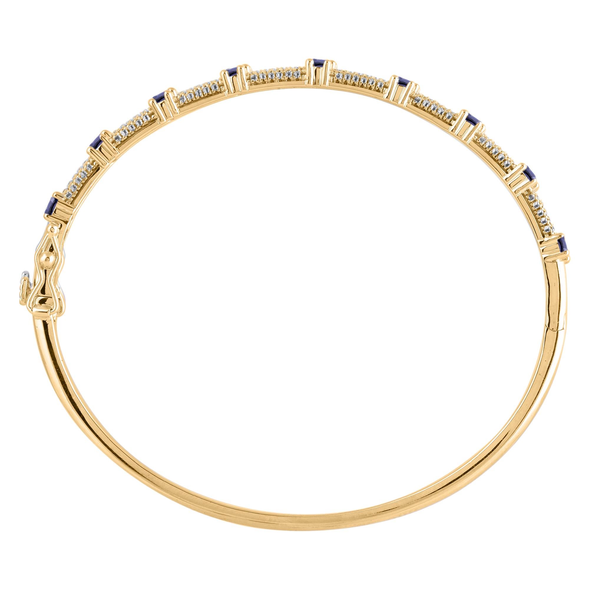 A minimalist look with a pop of color, this blue sapphire and diamond bangle bracelet pairs well with most any attire. This Shimmering bangle bracelet features 134 natural 0.50ct round single cut diamonds and 0.50 carats 9 blue sapphire in prong