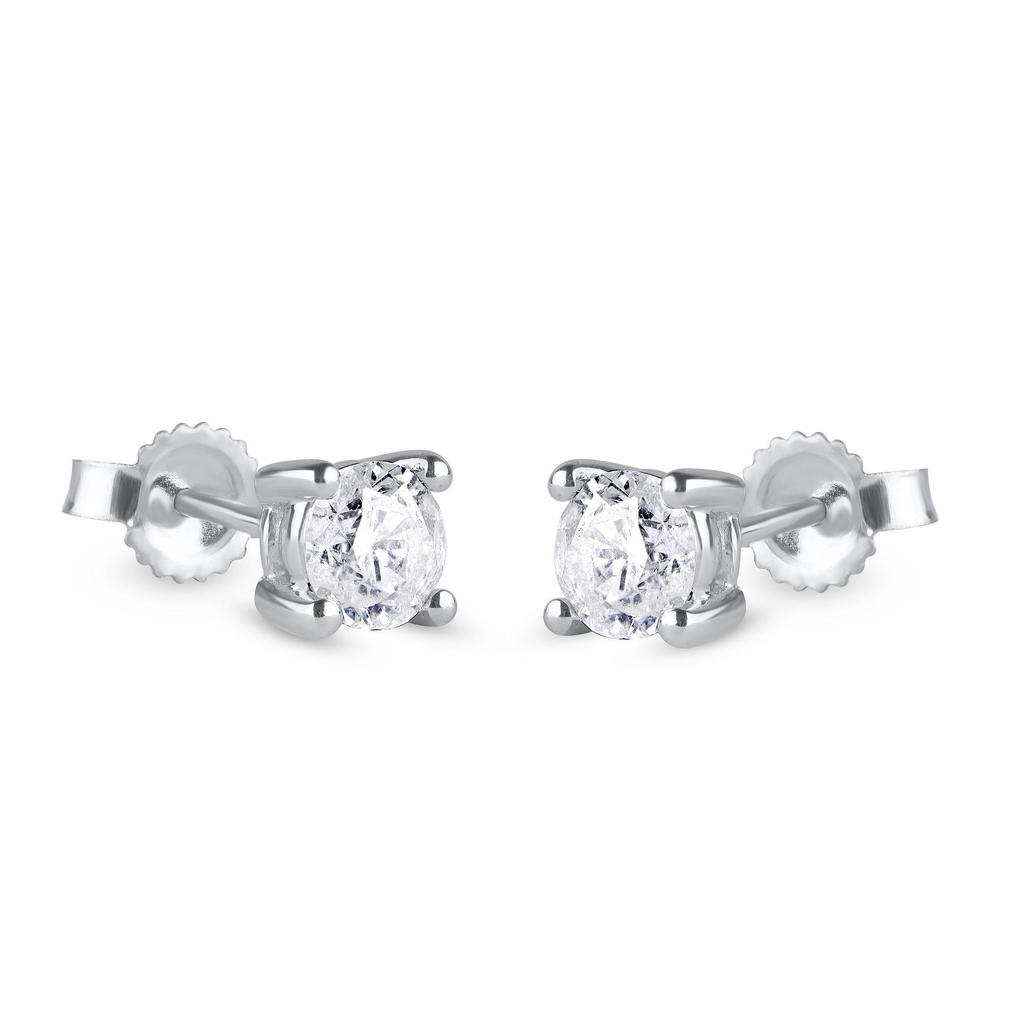 These diamond stud earrings are the perfect accessory. Made by our artisans in 10 karat white gold and each earring holds a single diamond in prong setting. The diamonds are graded G-H Color, I2-I3 Clarity. 
