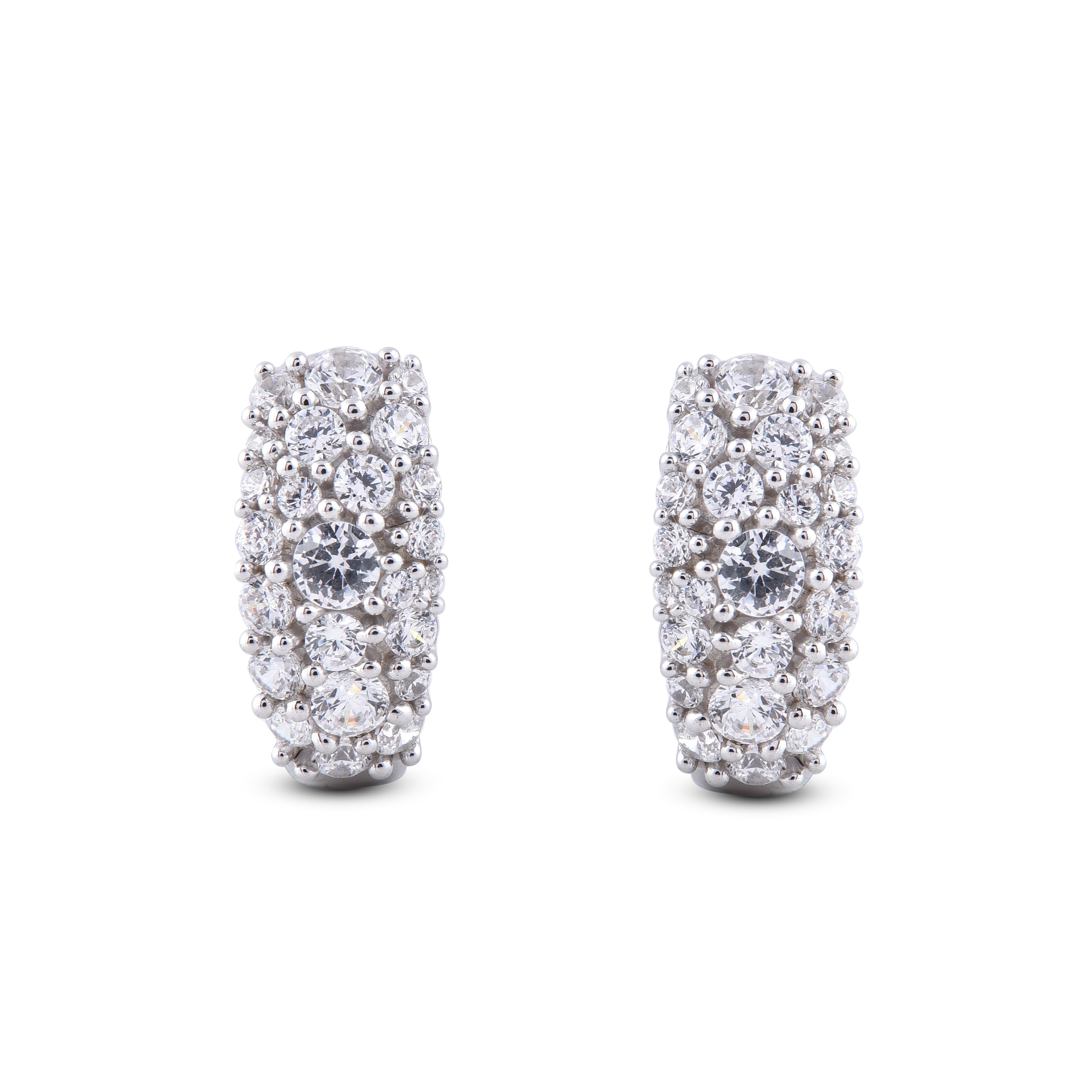 This pair of huggie hoop earrings is a truly elegant choice. This glamorous pair is made with 14 Karat white gold with modern glamour look. Carfted in 48 round diamond with H-I color I2 clarity. these huggie hoops secure comfortably with post.
