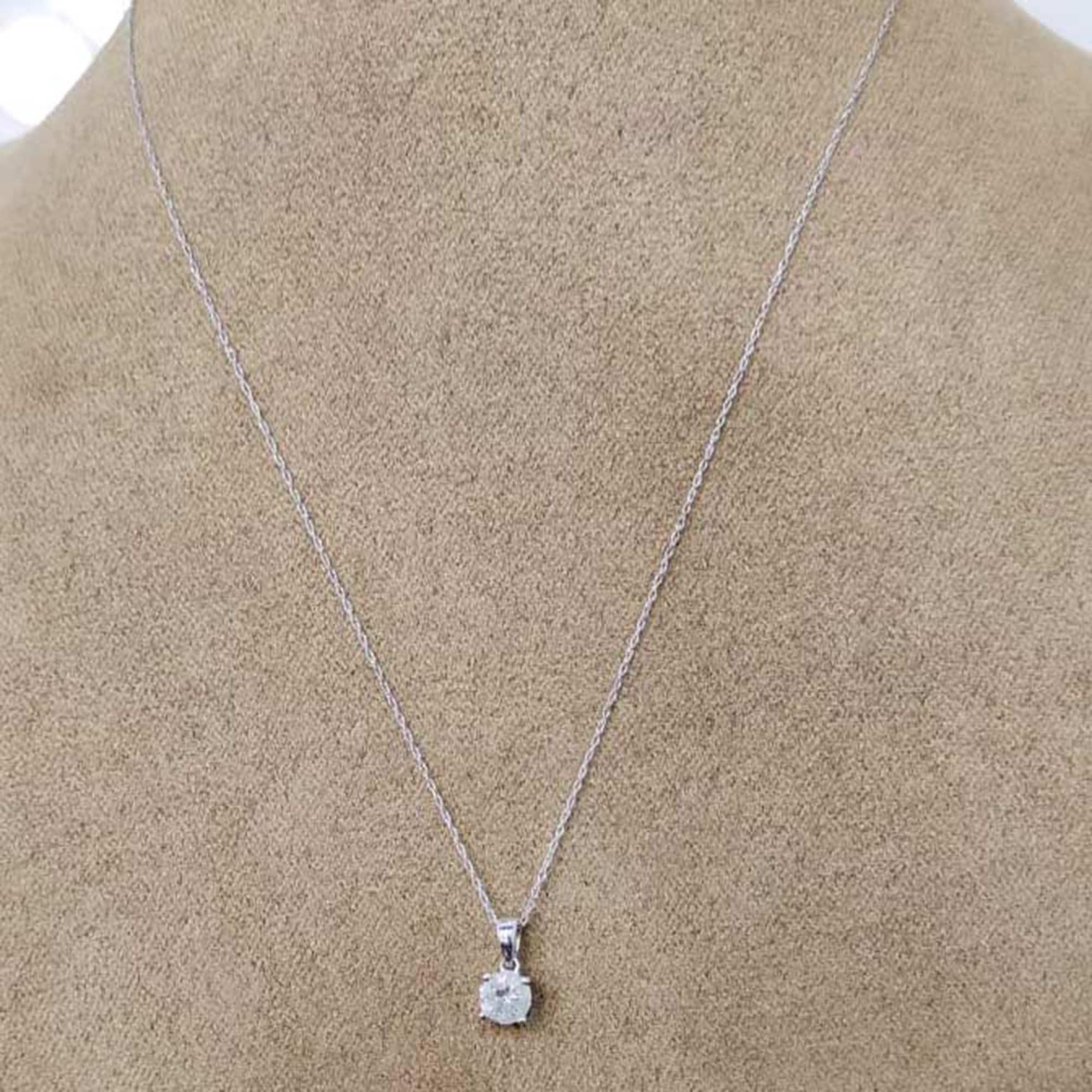 Beautifully hand-crafted by our skillful craftsmen in 14-karat white gold and this pendant features 1 brilliant-cut diamond studded in prong setting. The diamonds are graded H-I Color, I3 Clarity. The pendant comes along with an 18-inch cable chain.