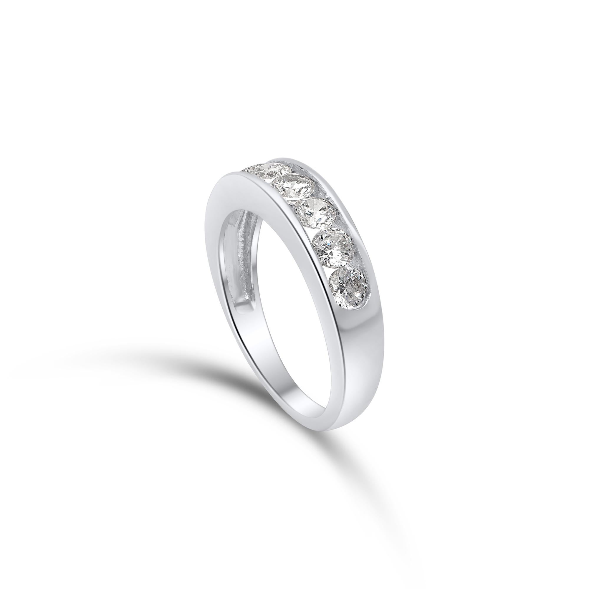 Embellished with seven brilliant-cut diamonds set beautifully in channel setting and fashioned in 18 kt white gold. Diamonds are graded H-I Color, I2 Clarity. 

Metal color and ring size can be customized on request. 

This piece is made to order.