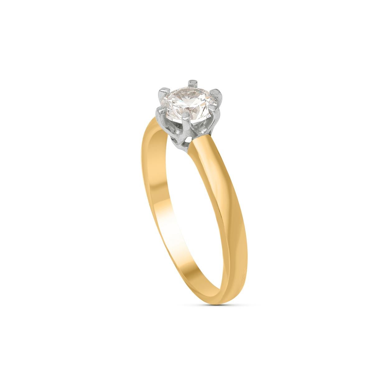 Scintillating with one brilliant-cut diamond beautifully set in prong setting and handcrafted by our in-house experts in 18 kt yellow gold. Diamonds are graded H-I Color, I1 Clarity. 

Metal color and ring size can be customized on request. 

This