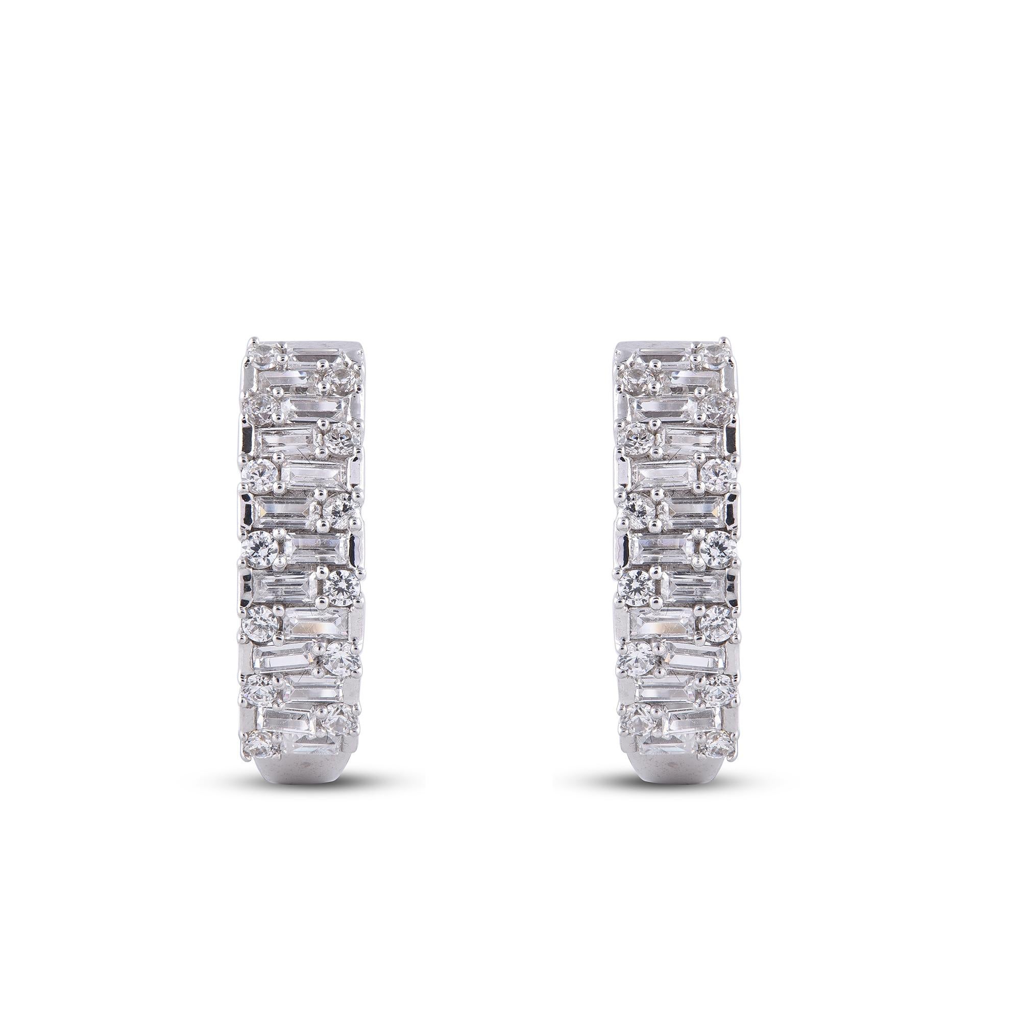 Adorn your formal wear with extra glitz when you put on these hoop earrings. Expertly crafted in 14K white Gold,  earring is cleverly filled with 26 round and 26 baguette-cut diamond set in prong and channel setting and dazzles in H-I color I2
