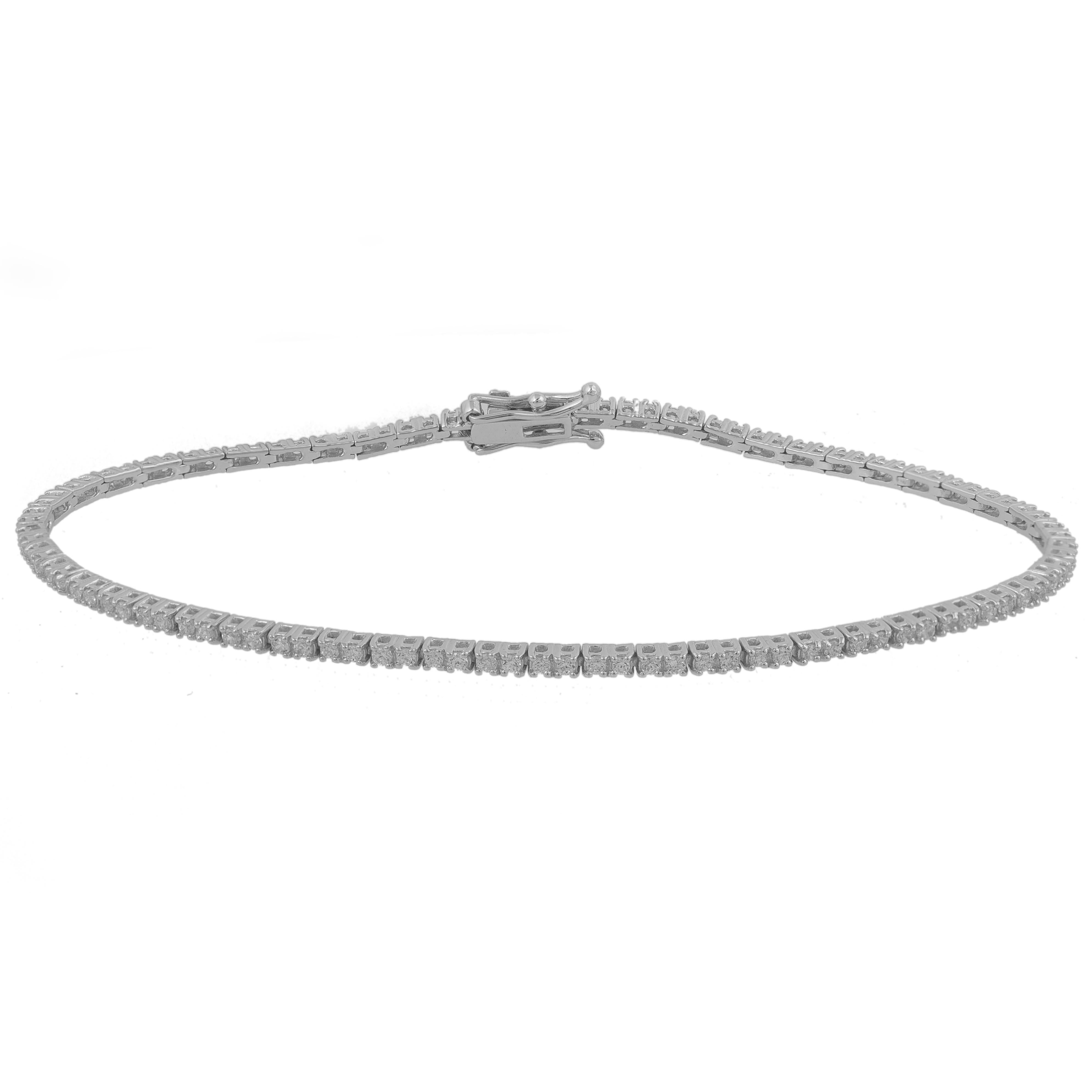 A graceful addition to her wardrobe, this diamond tennis bracelet brings the perfect touch of sparkle to her look. Beautifully hand-crafted by our inhouse experts in 14 karat white gold and embedded with 105 round brilliant diamond in prong setting.