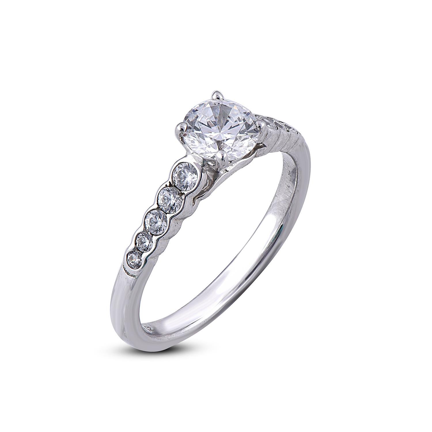 A touch of love, a touch of grace and a symbol of your love, this diamond wedding ring features 0.75 ct centre stone and 0.25 ct round diamond on shank set in prong and channel setting and shines with 11 round diamond in G-H color SI1-2 clarity. a