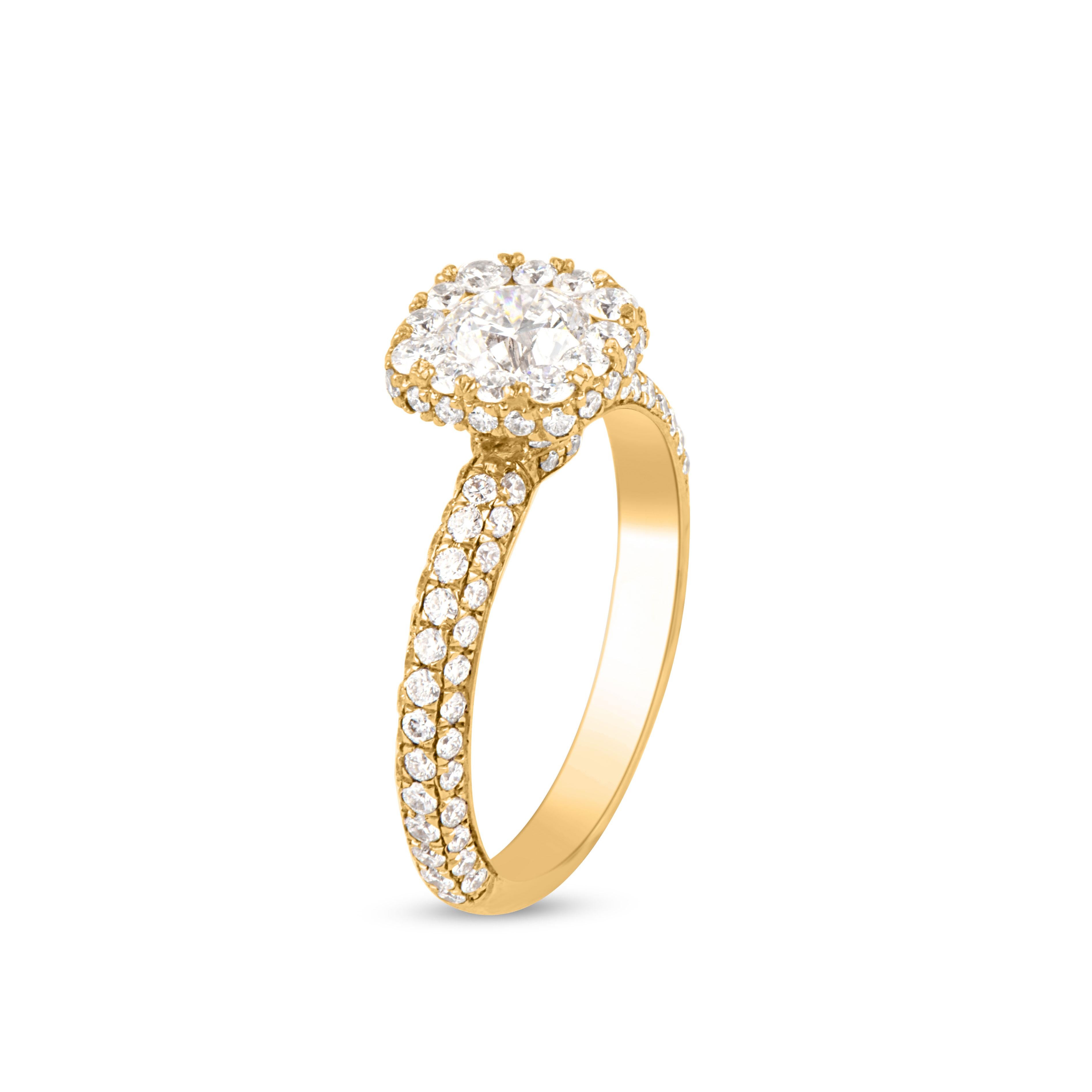 Stunning and classic, this diamond ring is beautifully crafted in 18K Yellow gold. The engagement ring feature 0.50 ct centre stone and 0.50 ct diamond frame and lined with rows of sparkling 98 round white diamonds in secured pressure and