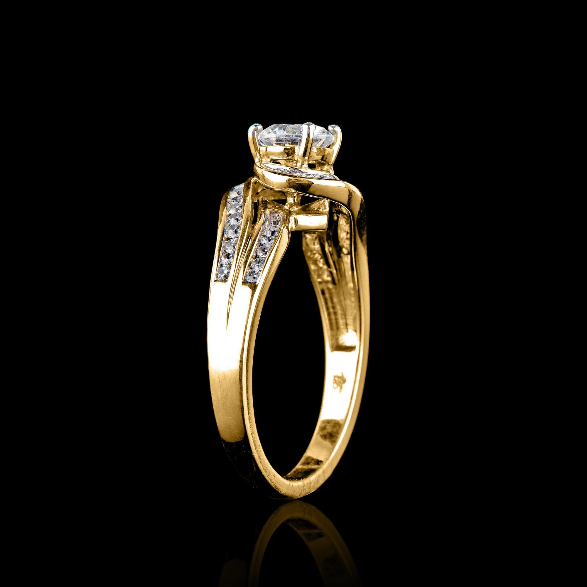 Truly exquisite, this entangled design 18 kt yellow gold diamond engagement band ring is sure to be admired for the inherent classic beauty and elegance within its design. This engagement band features 0.70 ct of centre stone and 0.30 ct of shank