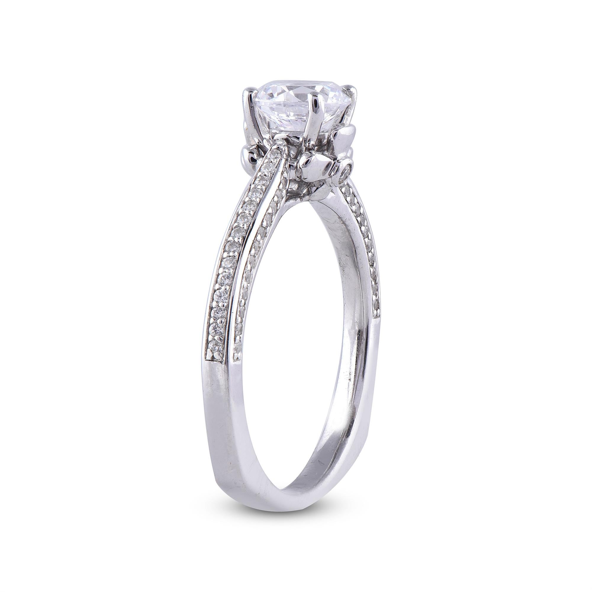 Truly exquisite, this 0.80 ct of centre stone and 0.20 ct of lined shank diamond ring is sure to be admired for the inherent classic beauty and elegance within its design. The total weight of diamonds 1.00 carat, G-H color, SI1 clarity and studded