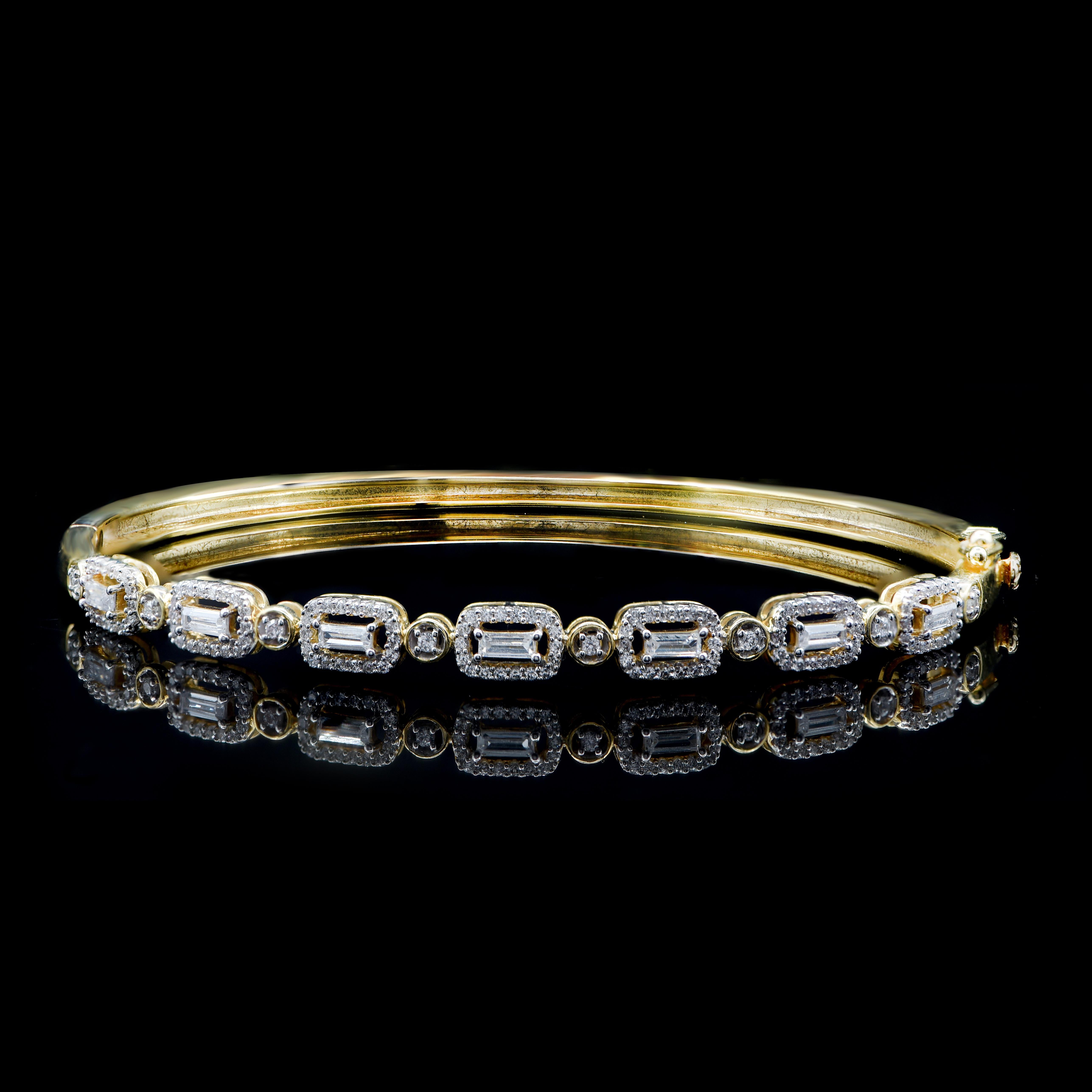This classic design features 134 brilliant cut and 7 baguette-cut natural diamonds elegantly set in stackable prong and prong setting and hand-crafted by our experts in 18-karat yellow gold. The diamonds are graded H-I Color, I2 Clarity. 
The