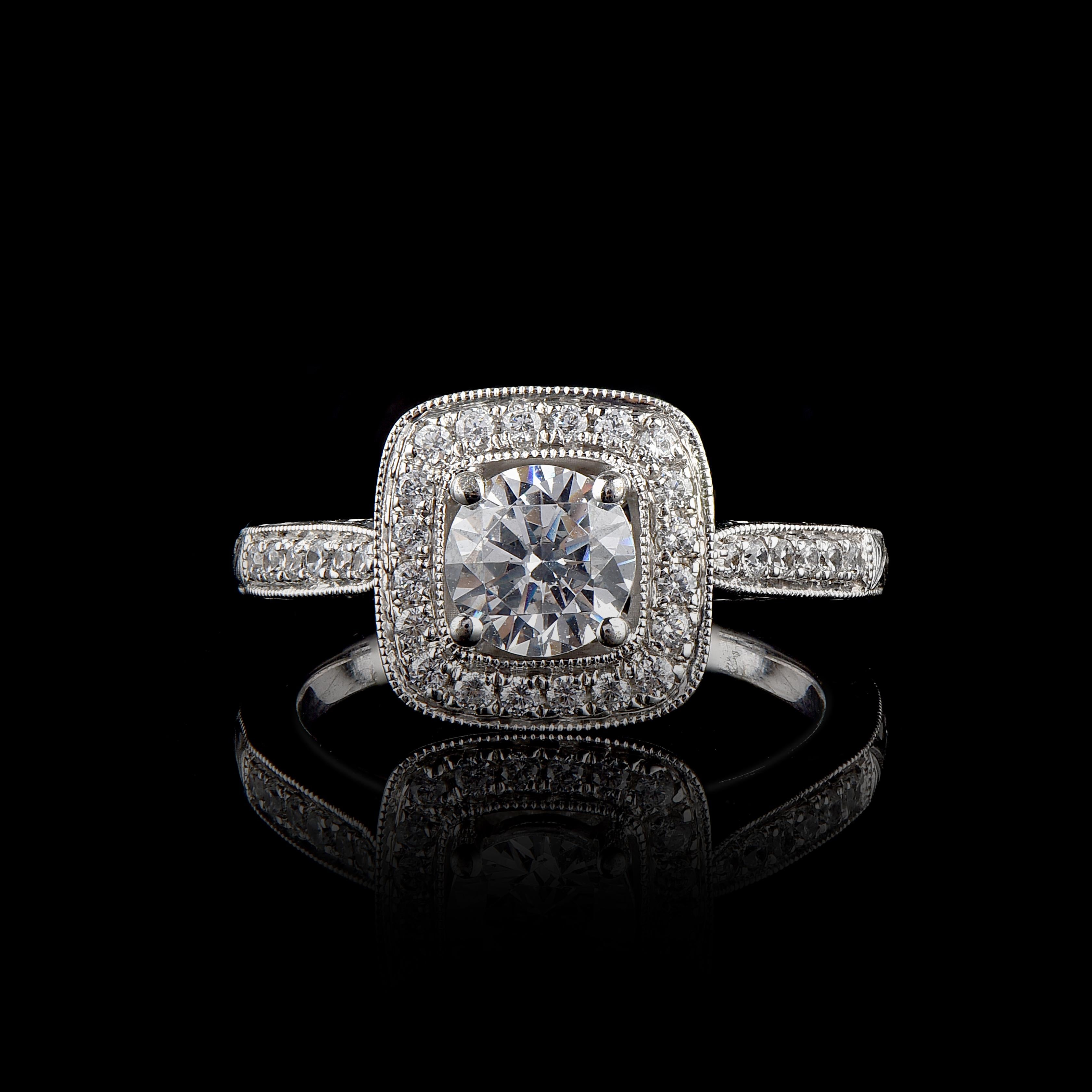 Beautiful Round Natural Diamond 18 karat white gold Engagement Ring. This ring is beautifully designed and features 0.80 ct center stone and 0.30 ct diamond frame and shank lined diamond set in micro-prong and prong set with 35 round brilliant cut
