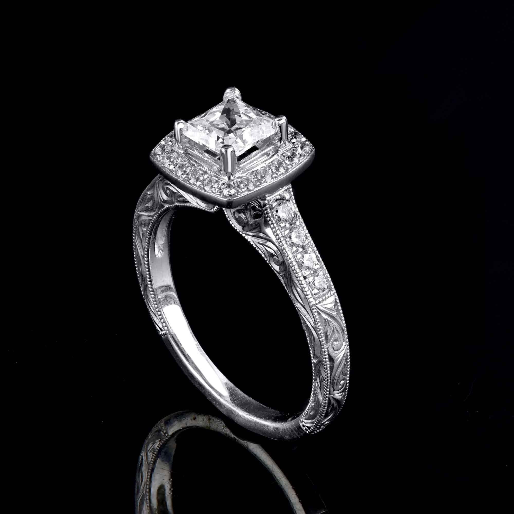 Let the timeless elegance of this Diamond Engagement Ring speak for you. This Ring is expertly crafted in 14 Karat White Gold and features 0.80 ct centre stone and 0.30 ct diamond frame and shank lined diamonds set in prong setting. The diamond are
