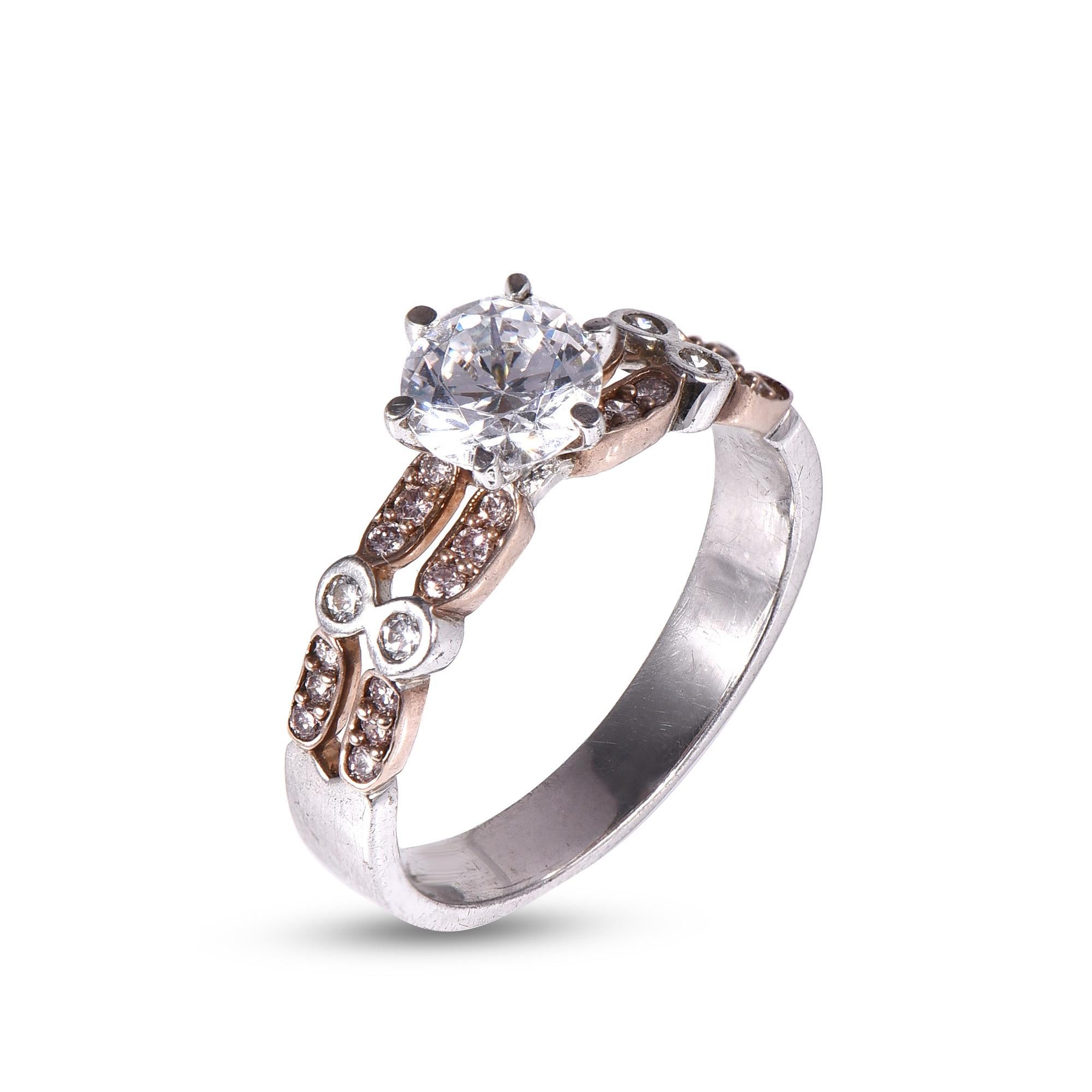 Exquisite 18 KT white gold ring featuring 0.85 ct centre stone and 0.30 ct split shank jewelled with white and pink diamonds. This ring is superbly detailed to perfection and set in secured prong, pave and bezel setting. The diamonds are natural,