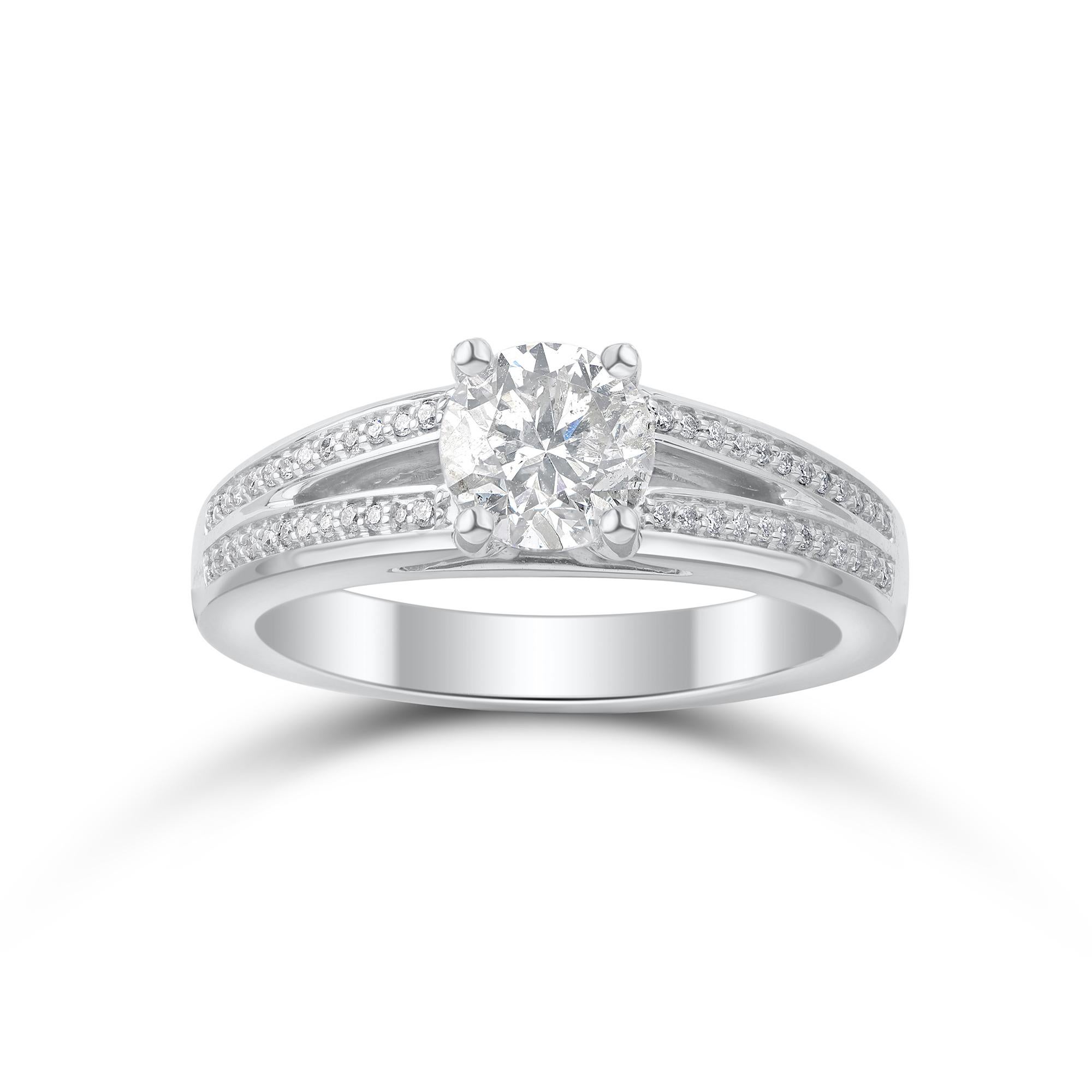 Beautiful white gold ring laced with diamonds is expertly handcrafted in 18 kt white gold and accentuated with 49 natural round diamond set in prong and pave setting. Diamonds are graded J-K Color, I3 Clarity. Ring is US size 7 and can be resized on