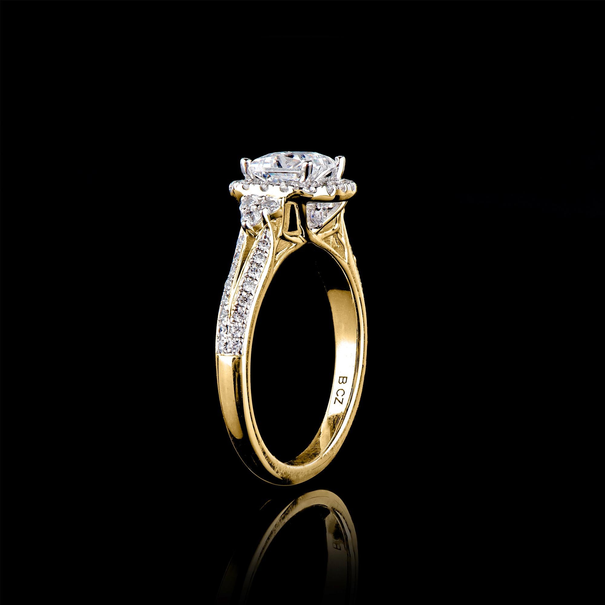 Lo squisito anello di fidanzamento con diamante presenta una pietra centrale da 0,80 carati e una montatura di diamanti da 0,43 carati con gambo diviso. Realizzato con maestria in oro bianco massiccio da 18 carati con finitura lucida e incastonato