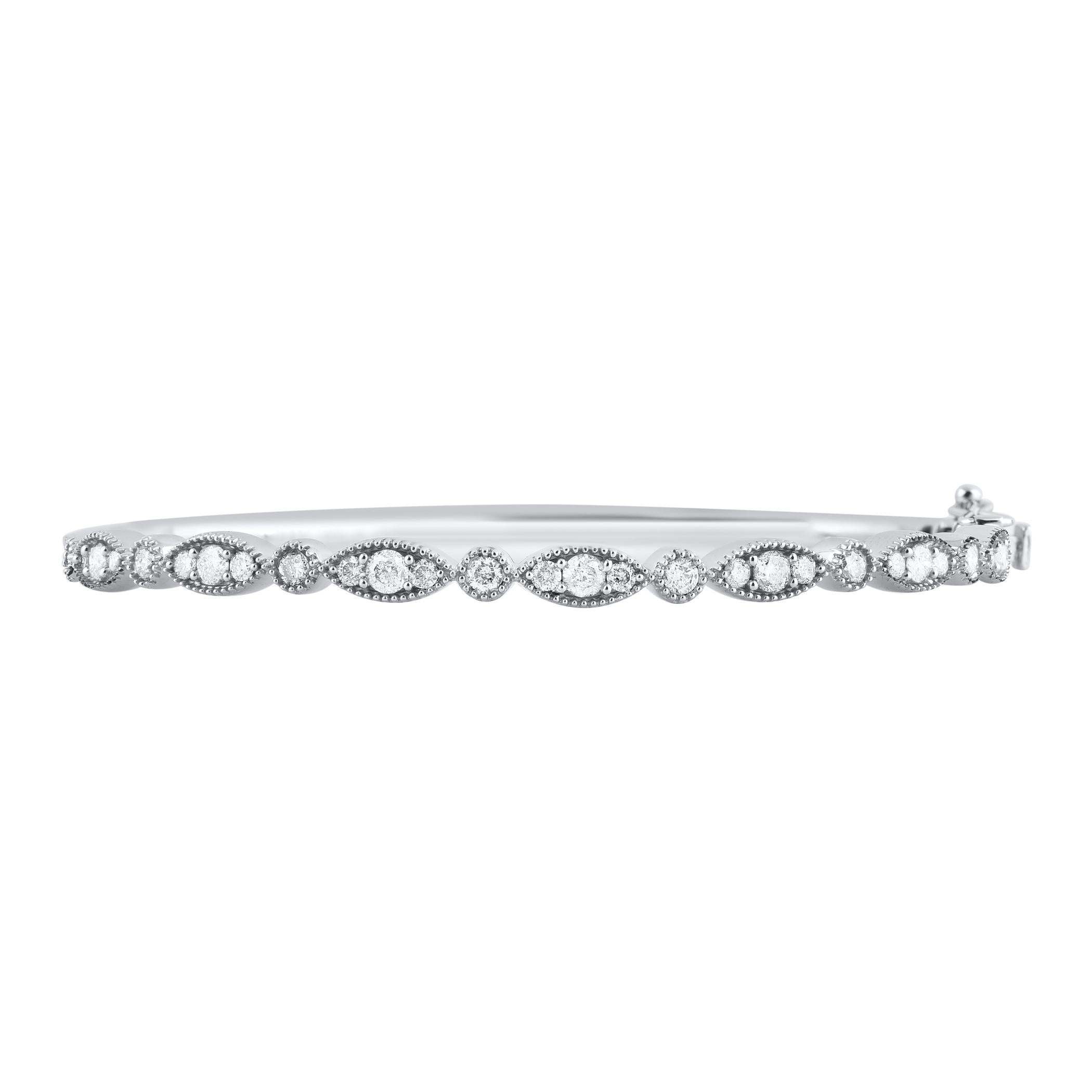 Enhance your everyday look with this diamond bangle bracelet. This Shimmering bangle bracelet features 29 natural round brilliant cut diamonds in prong and bezel setting and crafted in 14kt white gold. Diamonds are graded H-I color, I2 clarity. 