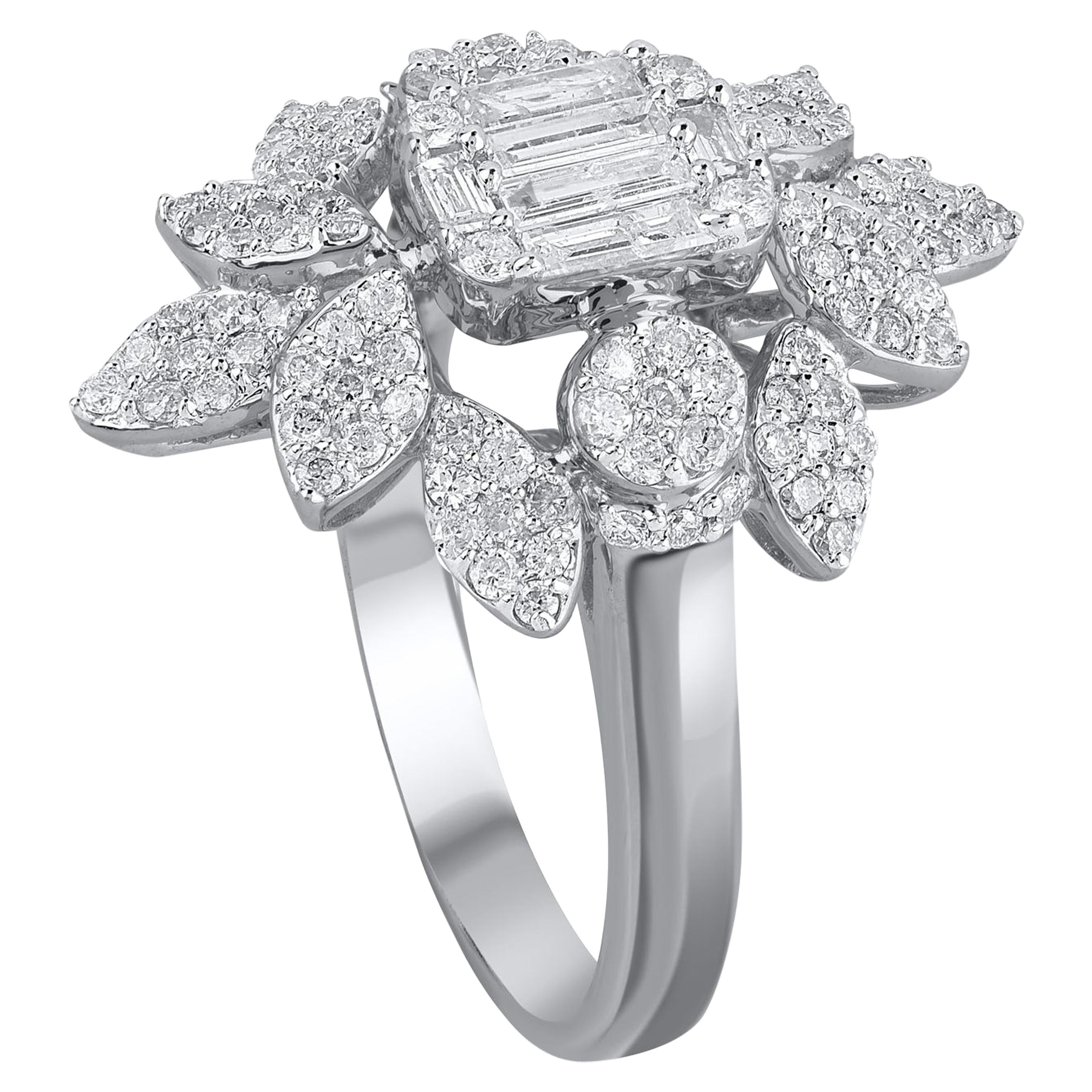 A centre baguette cut diamond surrounded by round diamonds in floral motifs. Studded with 114 round and 6 baguette diamonds in prong setting in 18 kt white gold. Diamonds are graded JK color, I3 clarity.   

Metal color and ring size can be