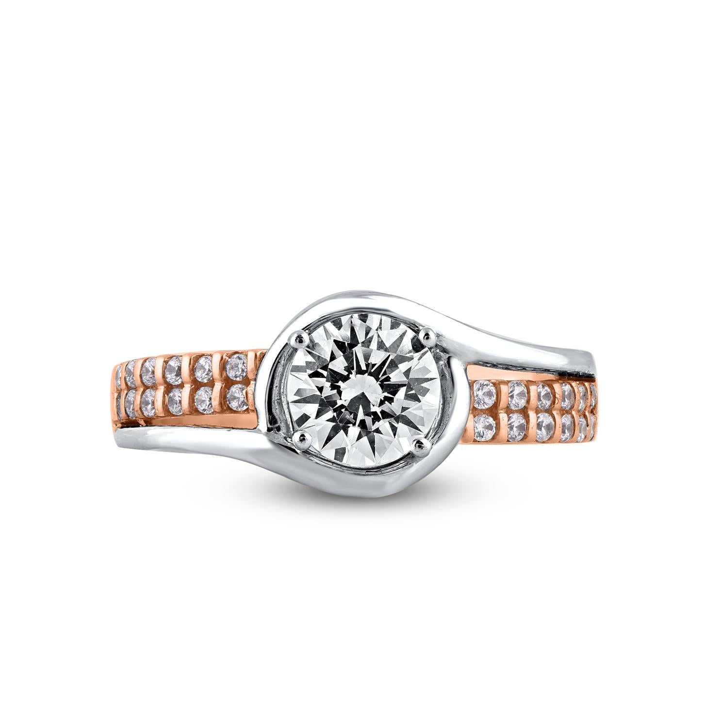 With style and shimmer, this diamond ring is perfect for any occasion. Beautifully crafted by our inhouse experts in 14 karat two tone gold and embellished with 29 brilliant cut round diamonds set in prong setting. Total diamond weight is 1.25