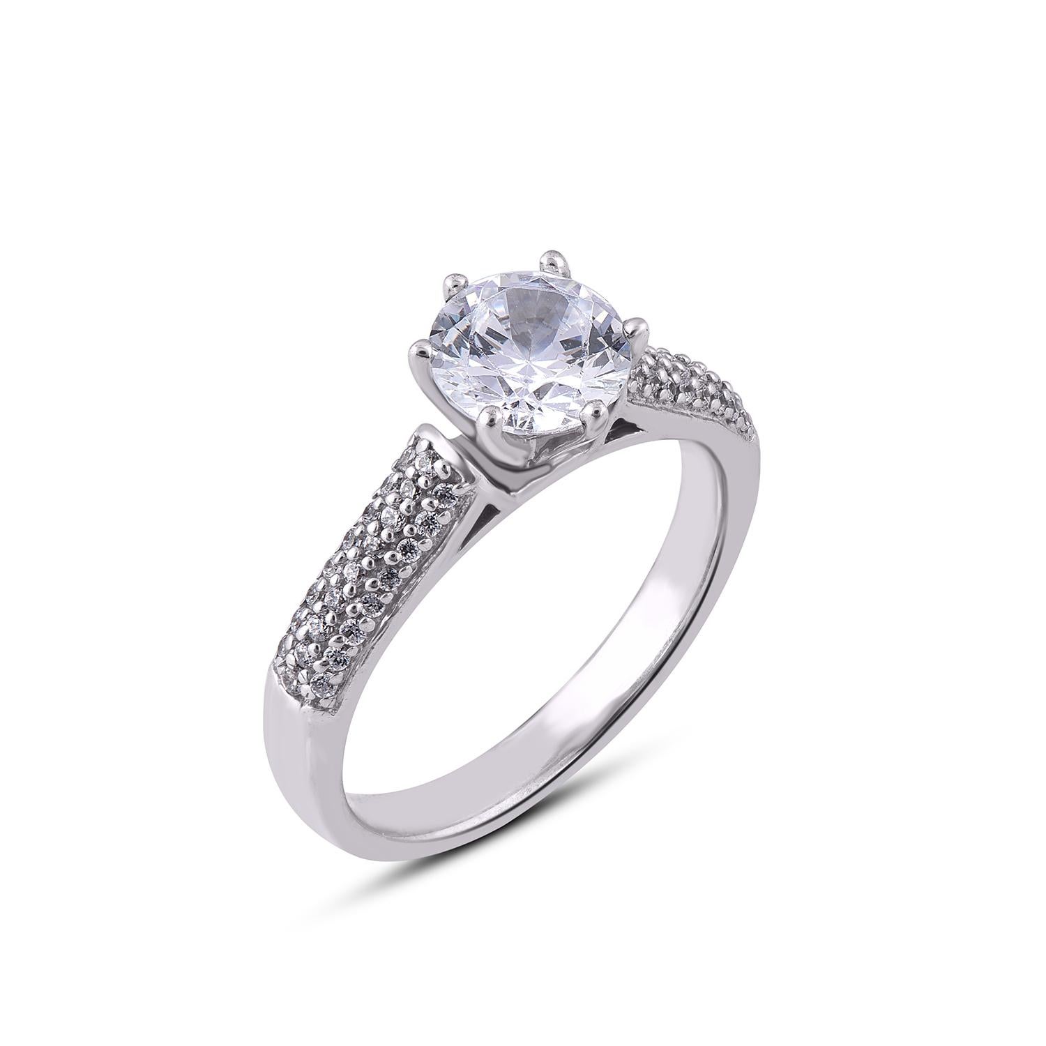 This Solitaire Engagement Ring is expertly crafted in 18 Karat white gold and features 1.00 ct center stone and 0.25 ct diamond frame and shank lined with 50 diamond set in prong and pave setting. The diamonds are natural, not treated and dazzles in