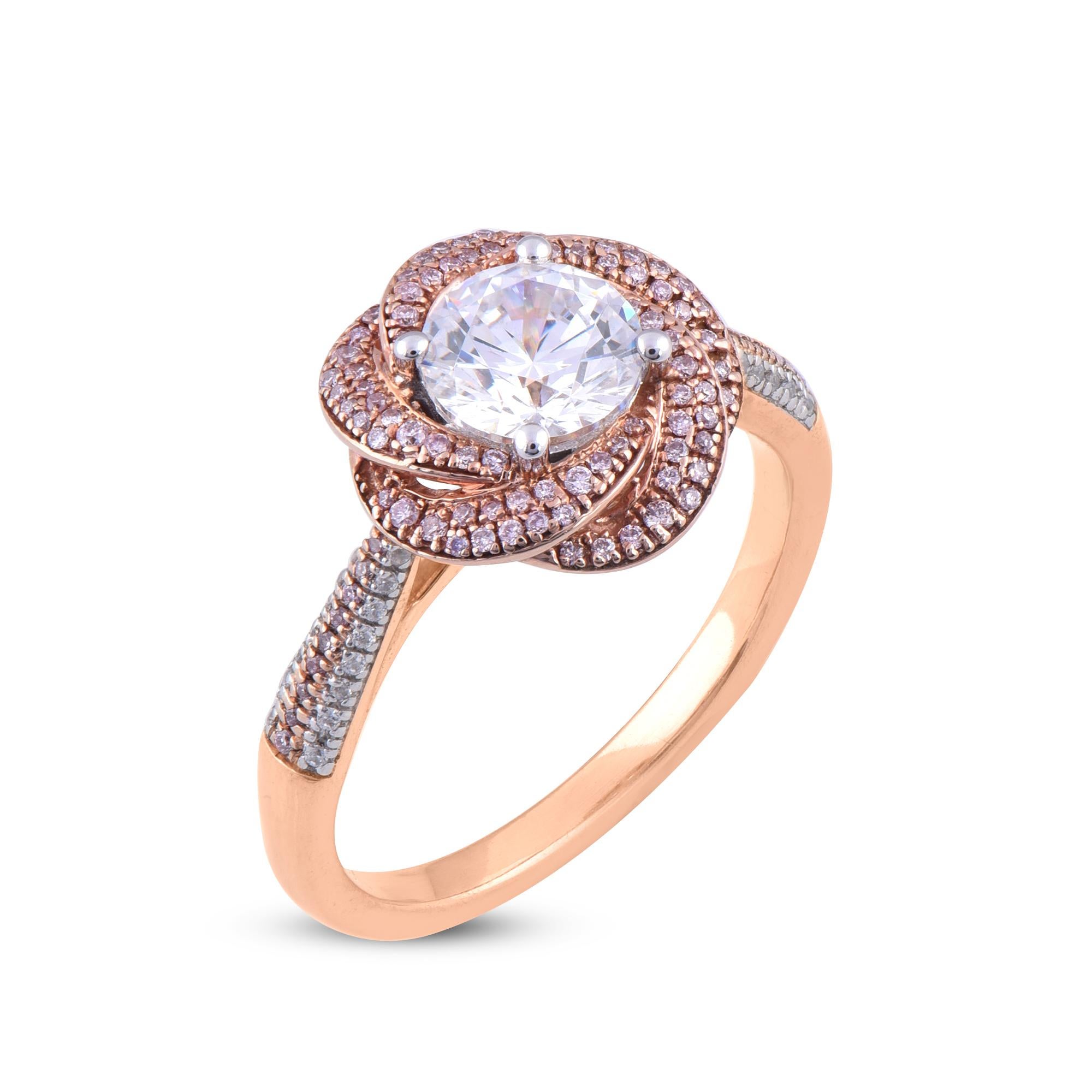 Hand crafted by our inhouse experts in 18 kt yellow gold the engagement ring has 1.00 ct centre stone and 0.33 ct of pink and white diamond studded beautifully around the centre stone and on the shank in micro pave setting. Dazzles in G-H color SI1
