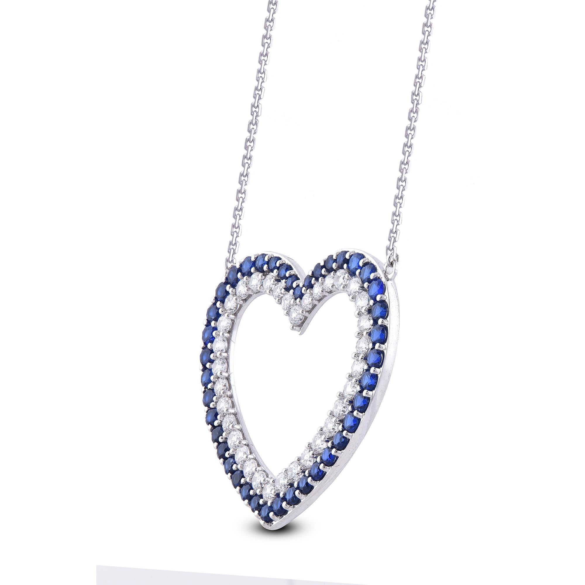 Embrace yourself with this breath-taking diamond studded heart pendant that is ready to make you shine. The pendant is crafted from 14 karat white gold and features 34 white diamond and 40 blue sapphire gemstone set in Prong setting, H-I color I2