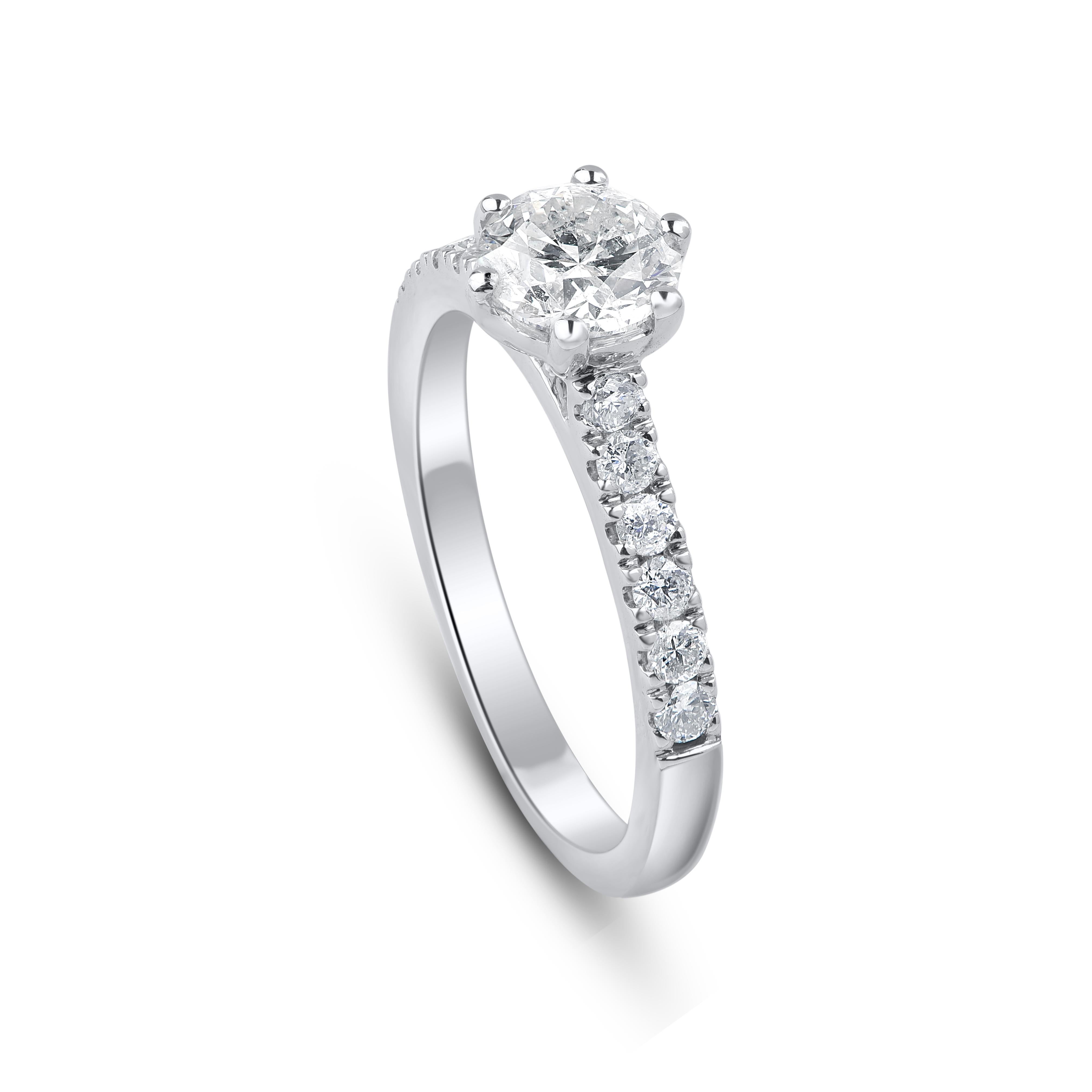 Fashioned in 18 kt white gold and this ring is studded with 13 round-cut diamonds in prong and micro-prong setting. Diamonds are graded J-K Color, I3 Clarity. Ring size is US size 7.25 and can be resized on request. 
