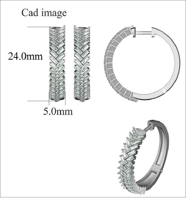 You'll adore the petite touch of shimmer these designer hoop earrings add to your attire. Beautifully hand-crafted by our inhouse experts in 14 karat white gold and embellished with 60 baguette-cut diamonds set in channel setting and shimmers with