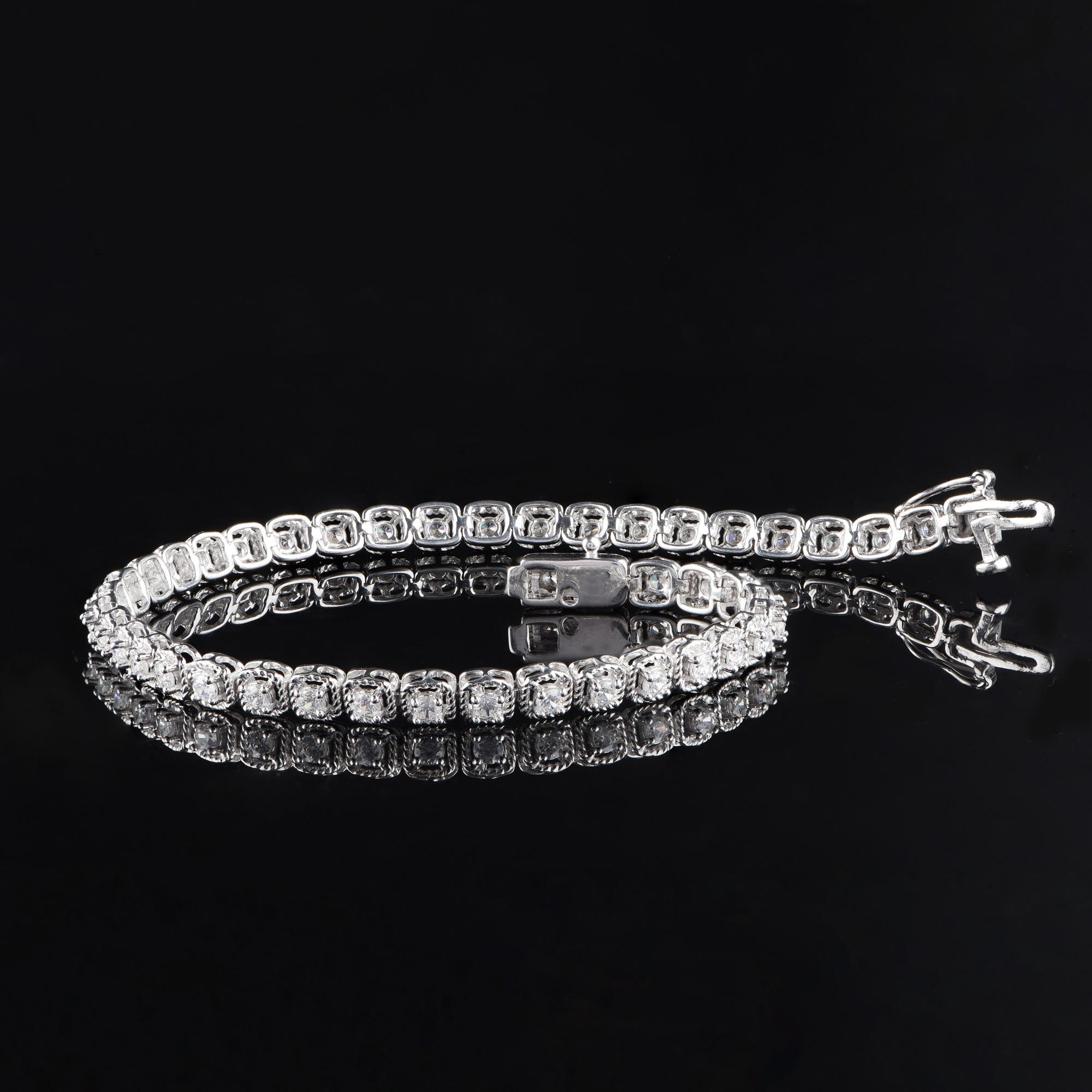 Make your wrist dazzle with designer bracelet studded with 44 brilliant diamonds elegantly set in prong setting and designed beautifully in 18 KT White Gold. The diamonds are graded H-I Color, I2 Clarity.