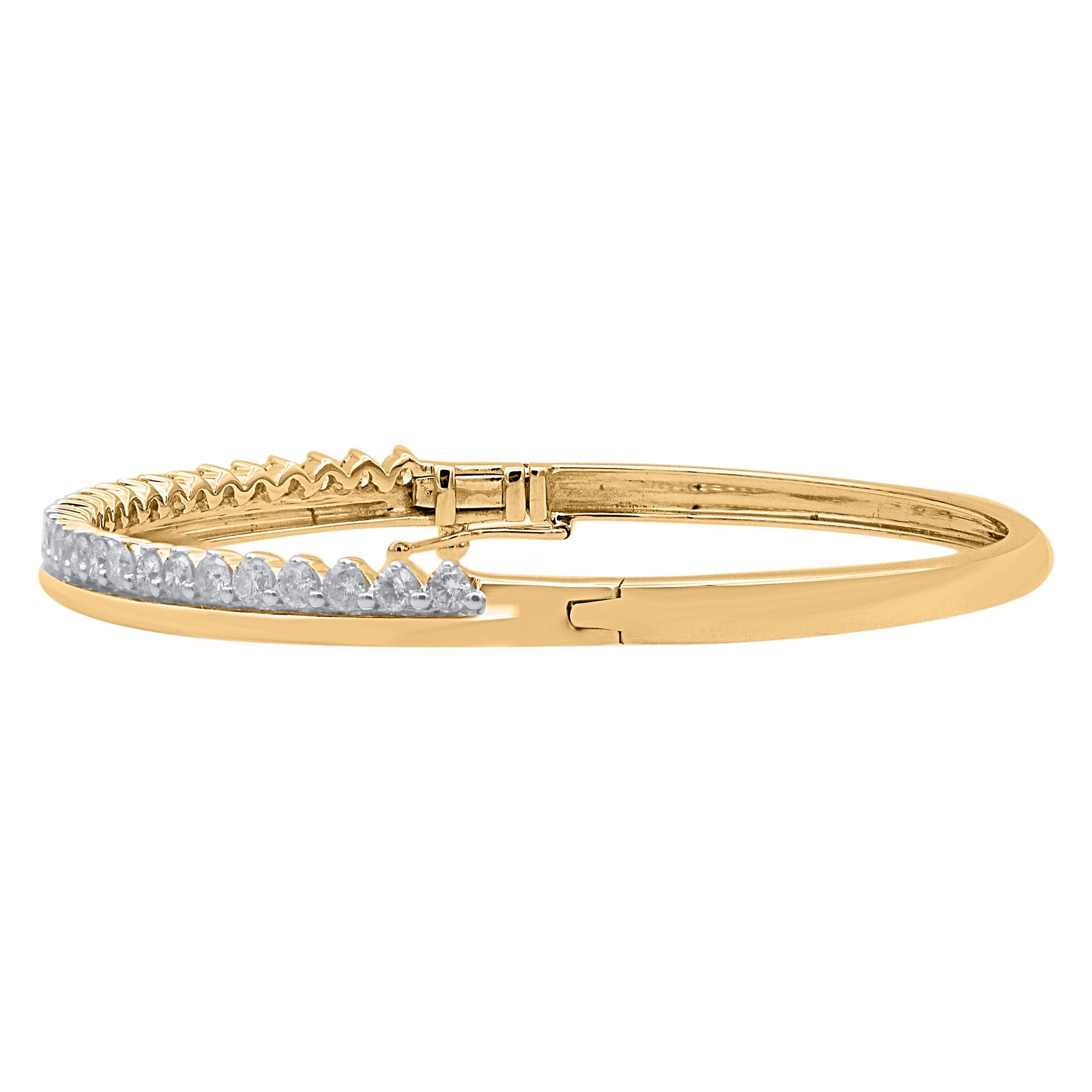 Classic and sophisticated, this diamond bangle bracelet pairs well with any attire.
This Shimmering bangle features 29 brilliant cut natural diamonds in prong setting and crafted in 14 kt yellow gold. Diamonds are graded H-I color, I2 clarity. 
