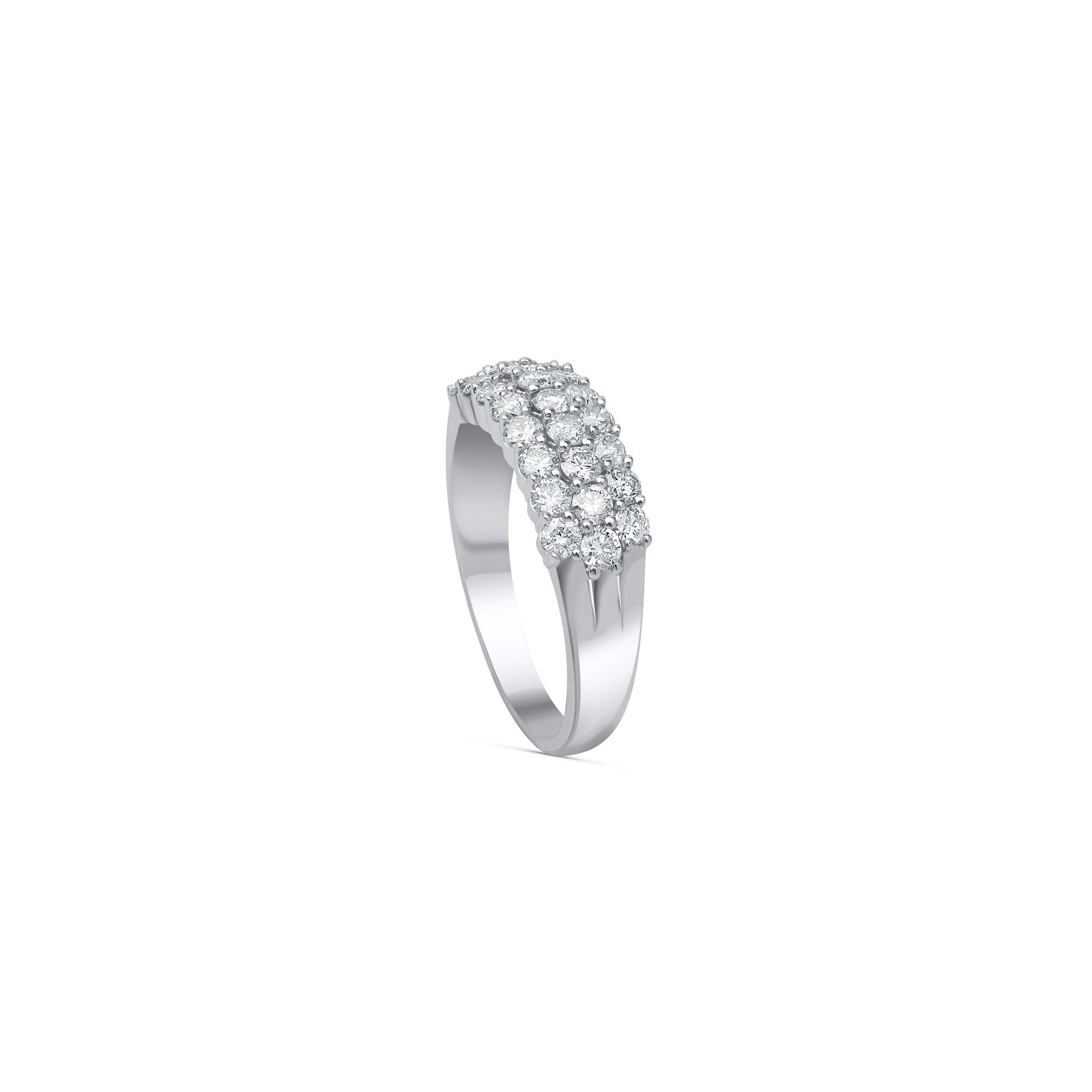 This diamond anniversary band is embellished with 25 brilliant diamonds set in prong setting and made by our in-house experts in 10 kt white gold. Will add a beautiful sparkle to your look. The diamonds are graded H-I color, I2 clarity. 

Metal